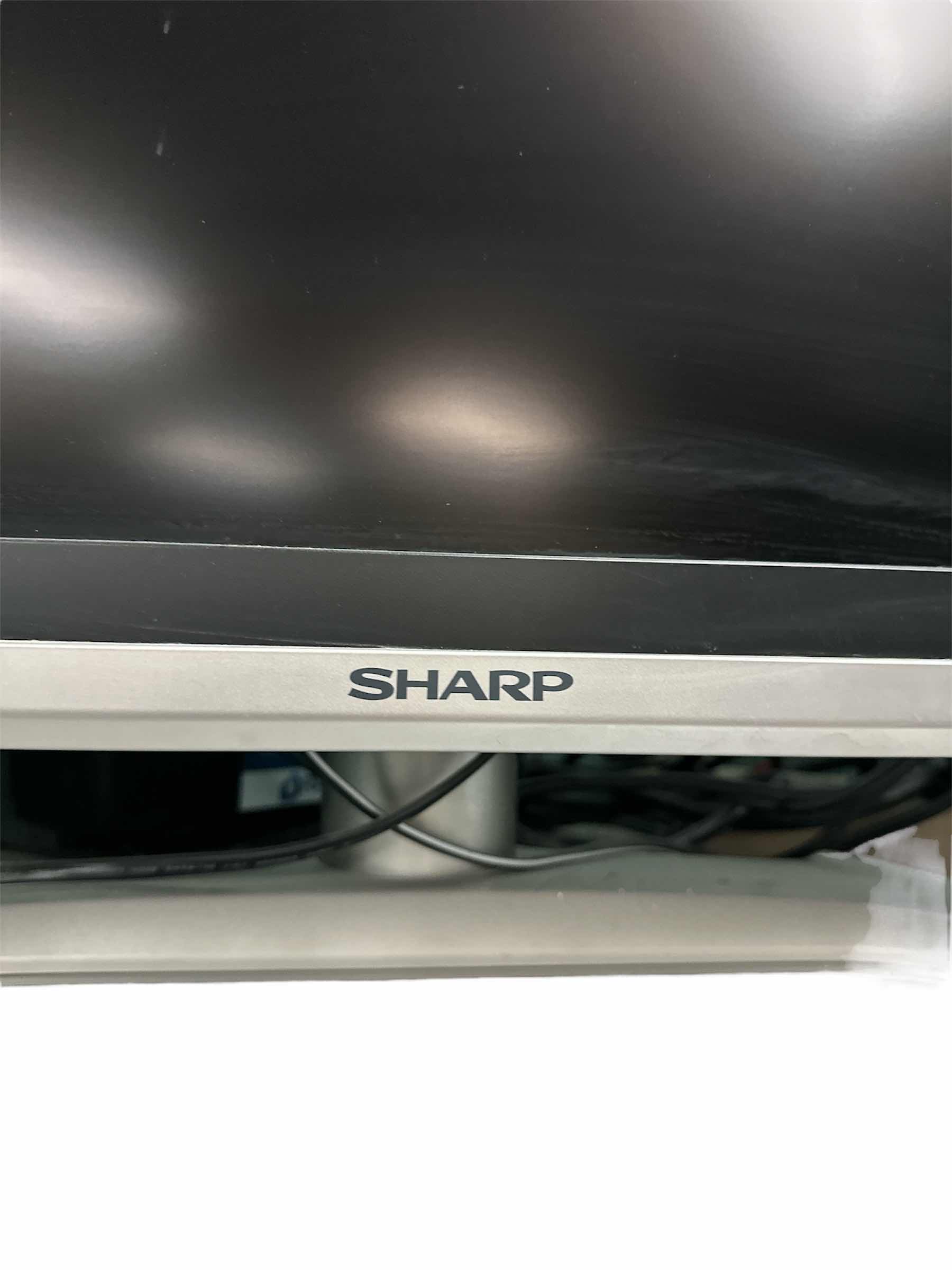 Photo 1 of 25” SHARP AQUOS TV WITH ATTACHED SIDE SPEAKERS
33.5” X 11” X 19.25”H