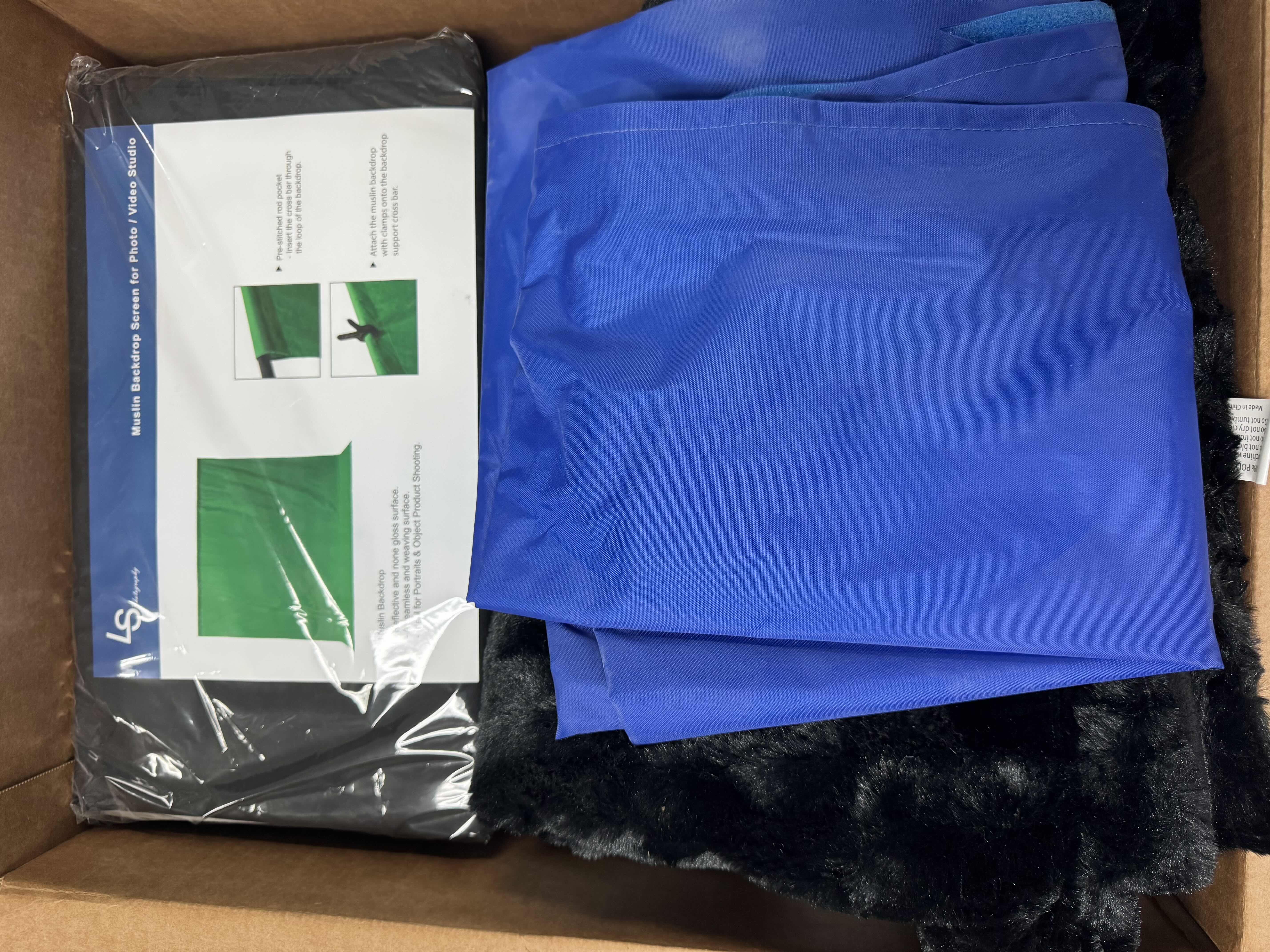 Photo 1 of BOX OF ASSORTED BACKDROP SCREENS FOR PHOTOGRAPHY 
BOX SIZE 
22” X 17” X H12”