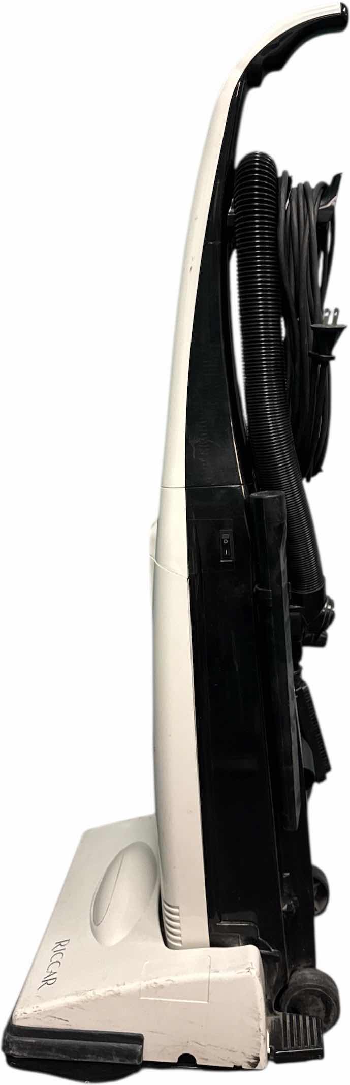 Photo 1 of VINTAGE RICCAR VIBRANCE VACUUM WITH VACUUM BAGS, OWNERS MANUAL INCLUDED 
15” X 14” X H44”
