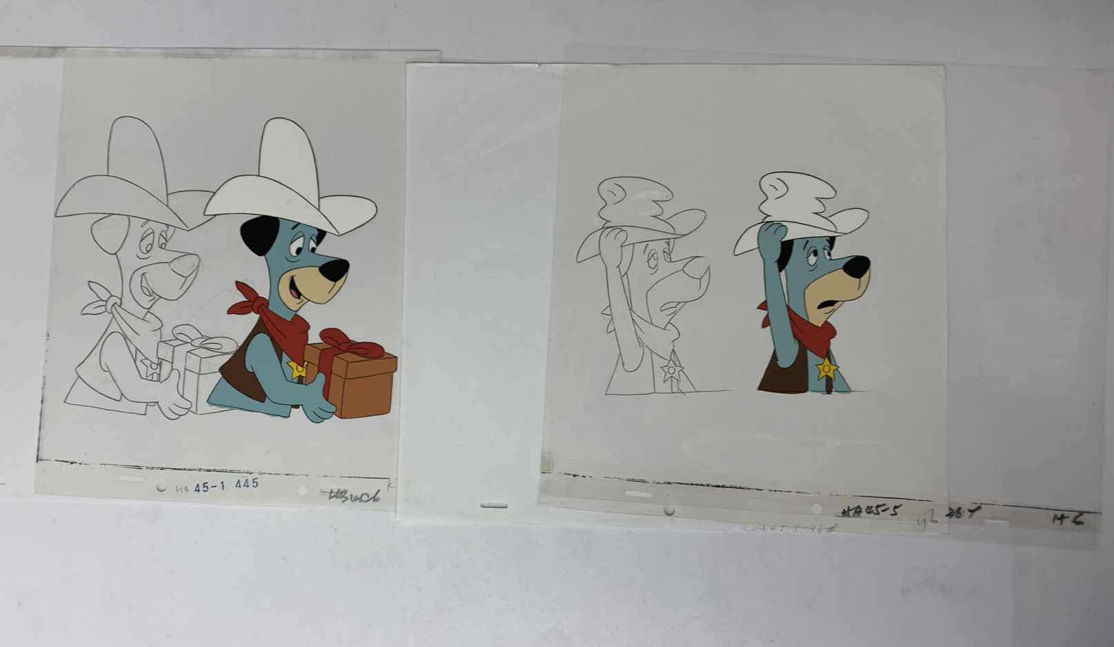 Photo 1 of VINTAGE HANNA BARBERA HAND PAINTED ANIMATION CEL WITH HUCKLEBERRY HOUND 8” X 10”