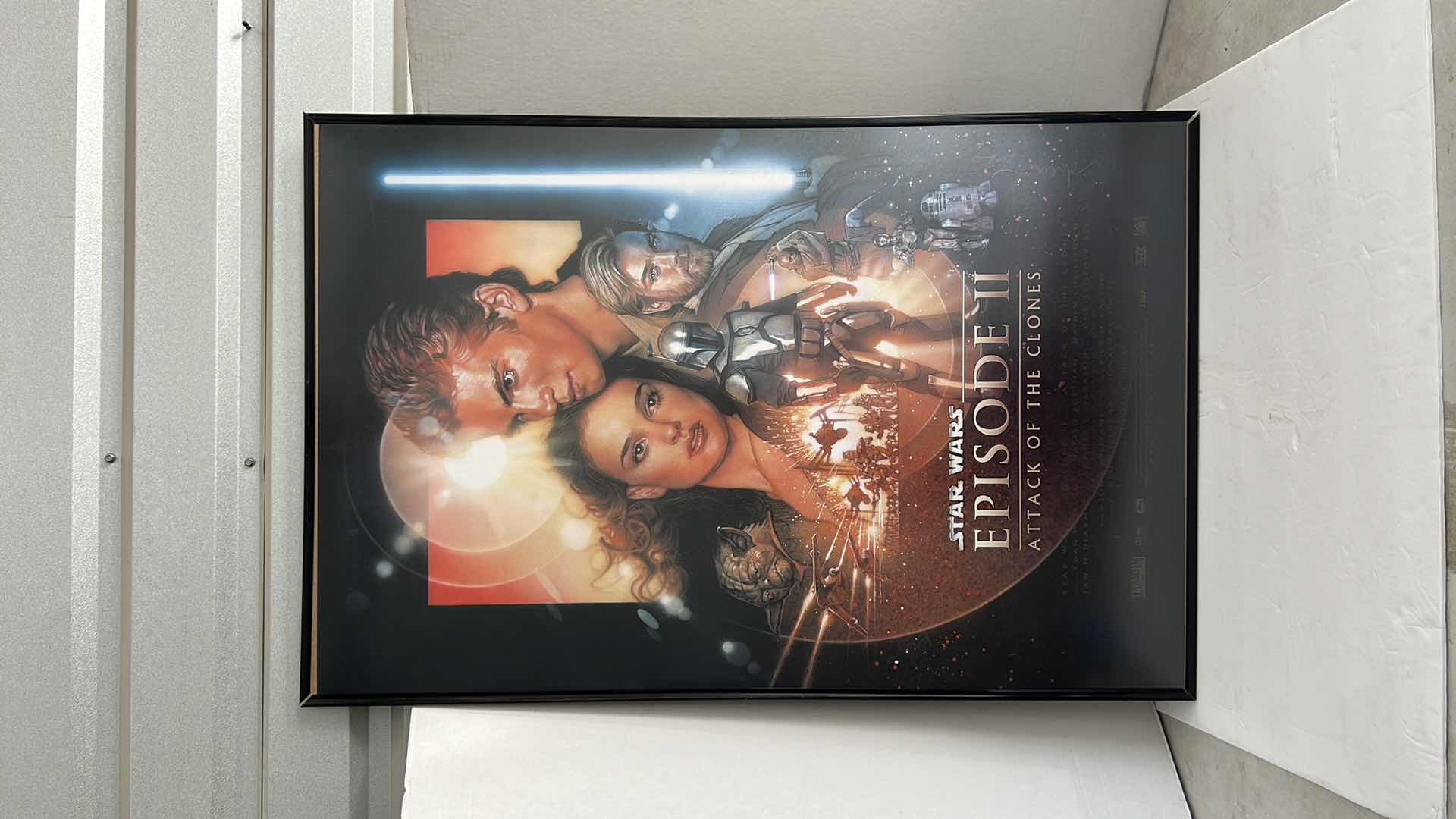 Photo 1 of STAR WARS EPISODE II ATTACK OF THE CLONES MOVIE POSTER WITH BLACK PLASTIC FRAME 27”W X 40”H