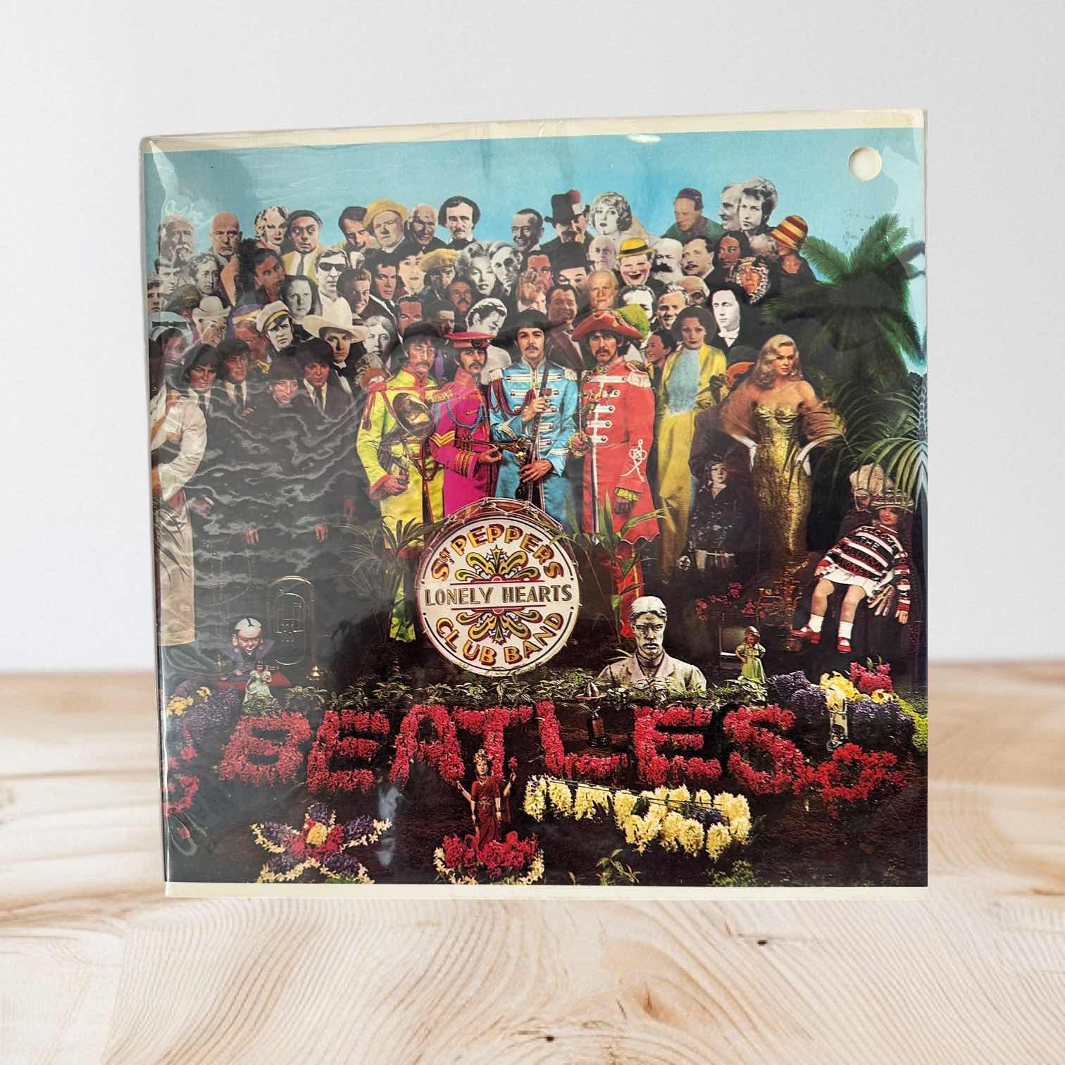 Photo 1 of BEATLES 1967 SGT. PEPPERS VINYL ALBUM IN SEALED WRAPPING