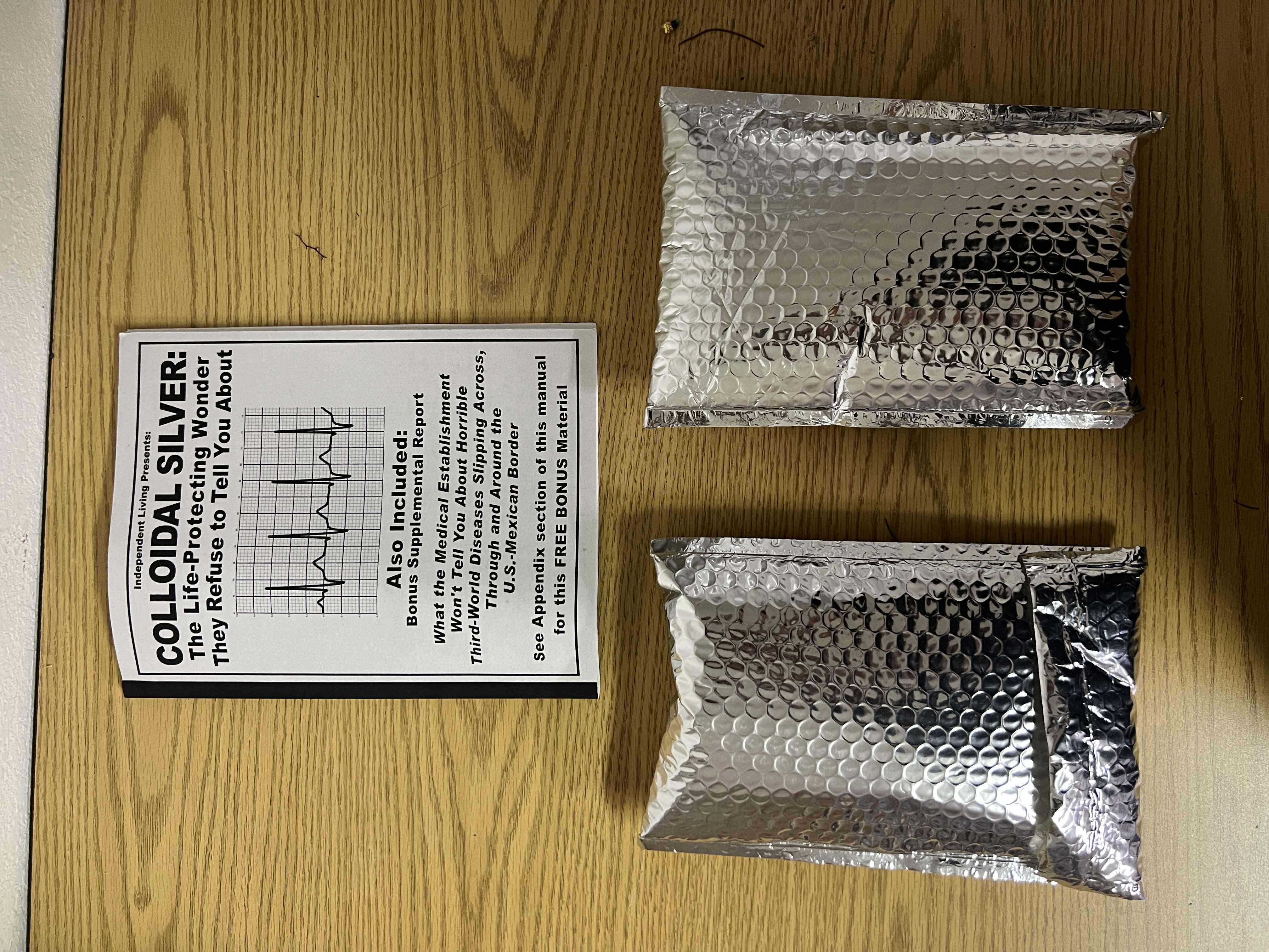 Photo 1 of 2 BAGS OF COLLOIDAL SILVER AND BOOKLET