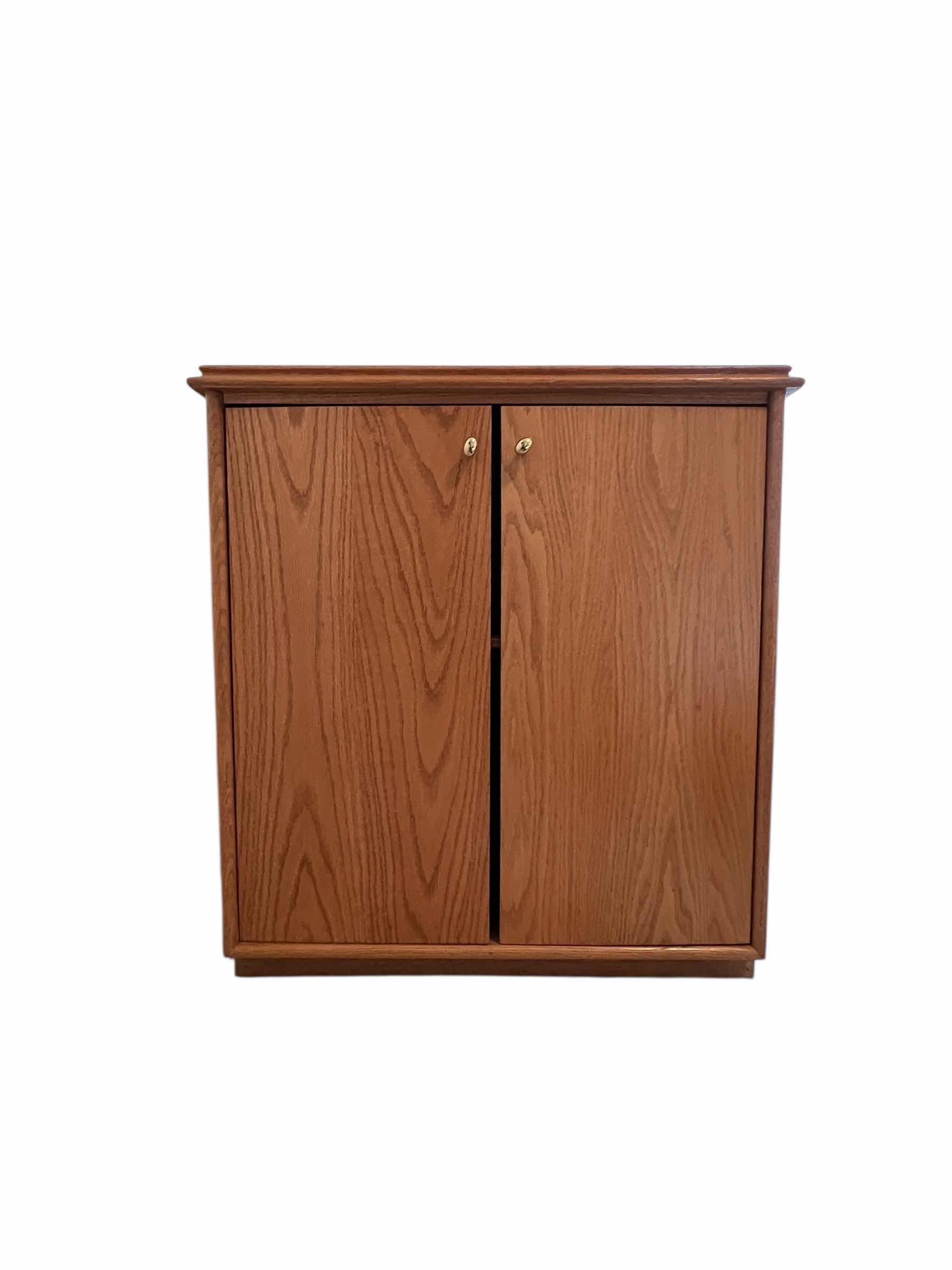 Photo 1 of WOODEN CABINET WITH BRASS COLORED HANDLES 29”W X 24”D X 32”H