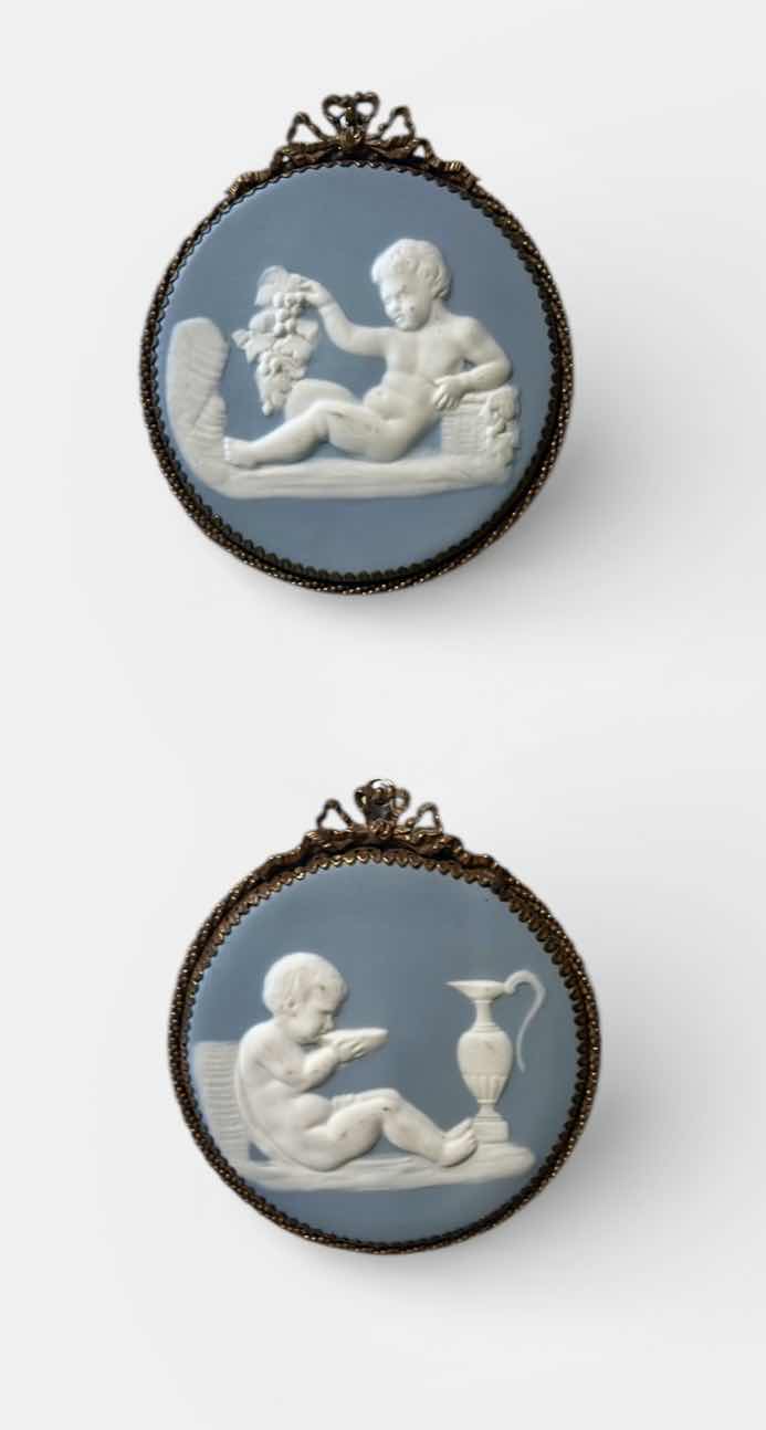 Photo 1 of 2- WEDGWOOD-STYLE JASPERWARE PLAQUES, LIKELY DEPICTING CHERUBS OR FIGURES FROM CLASSICAL MYTHOLOGY. H6”