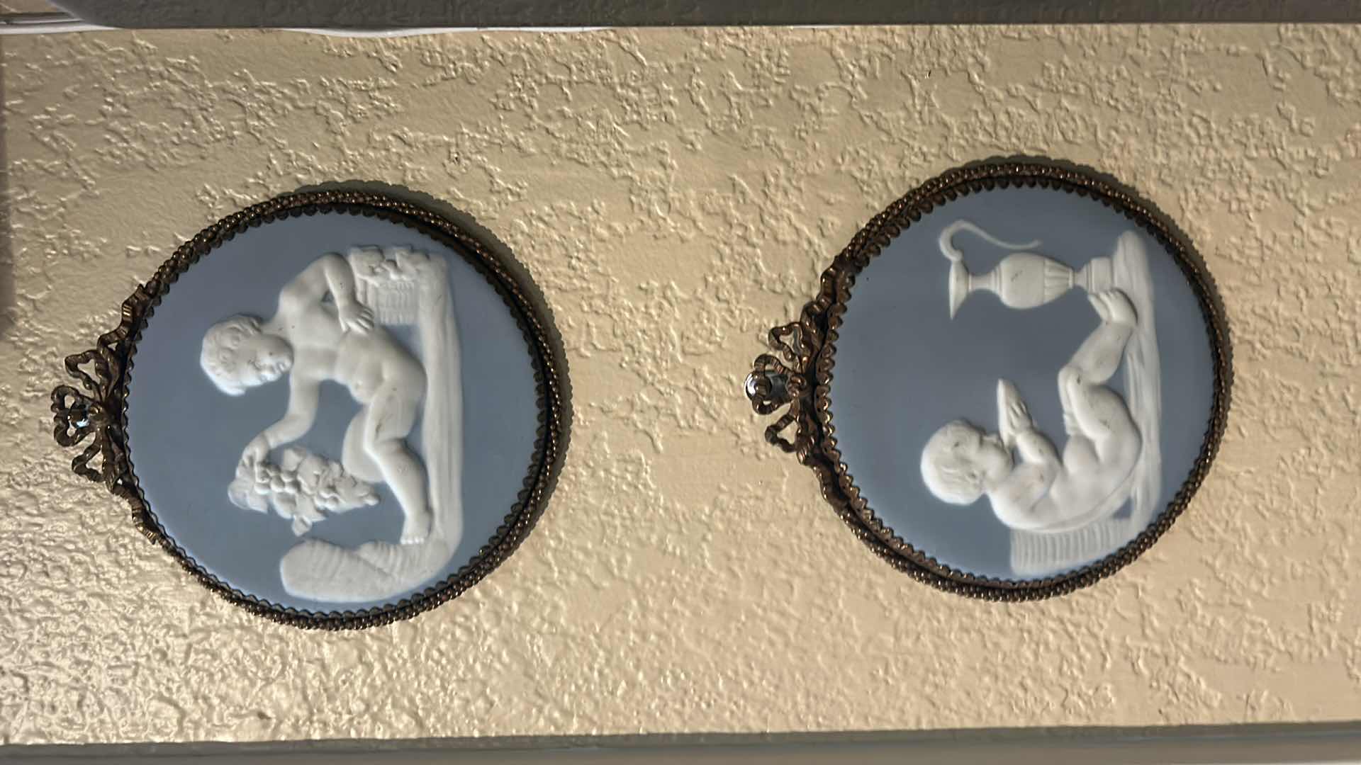 Photo 1 of 2- WEDGWOOD-STYLE JASPERWARE PLAQUES, LIKELY DEPICTING CHERUBS OR FIGURES FROM CLASSICAL MYTHOLOGY. H6”