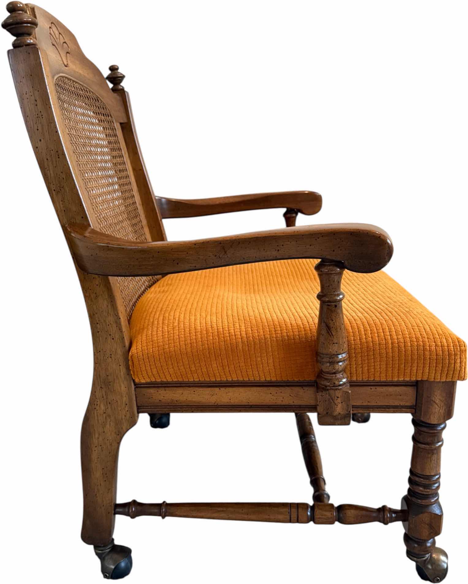 Photo 1 of VINTAGE WALNUT WOOD W CANE BACK DINING ARM CHAIR ON CASTERS W ORANGE CUSHION
