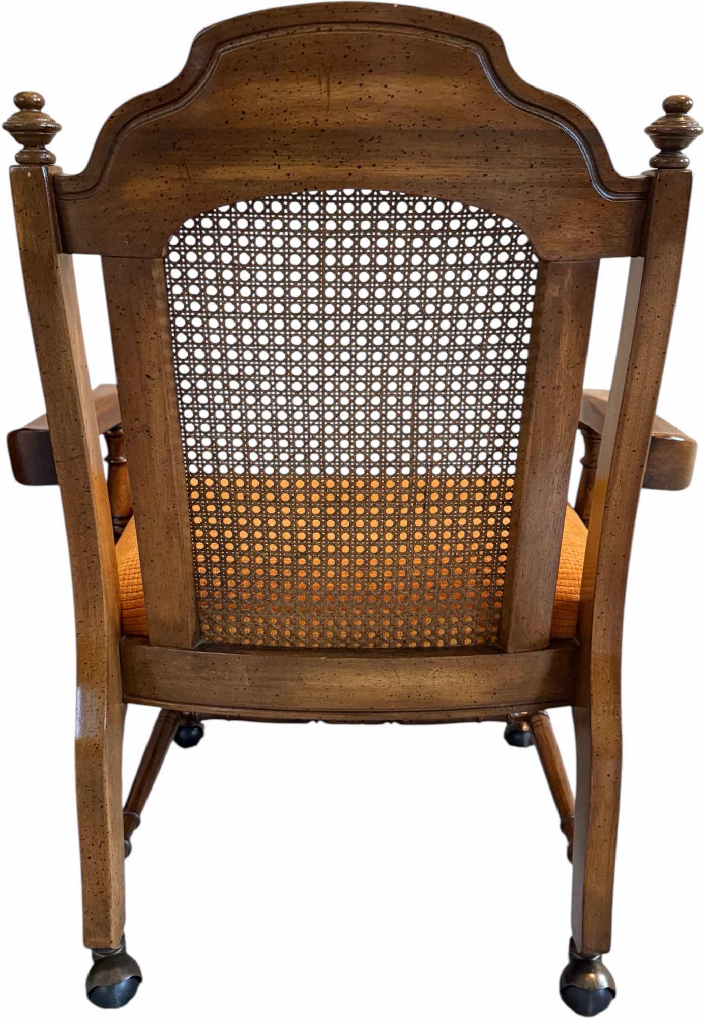 Photo 1 of VINTAGE WALNUT WOOD W CANE BACK DINING ARM CHAIR ON CASTERS W ORANGE CUSHION