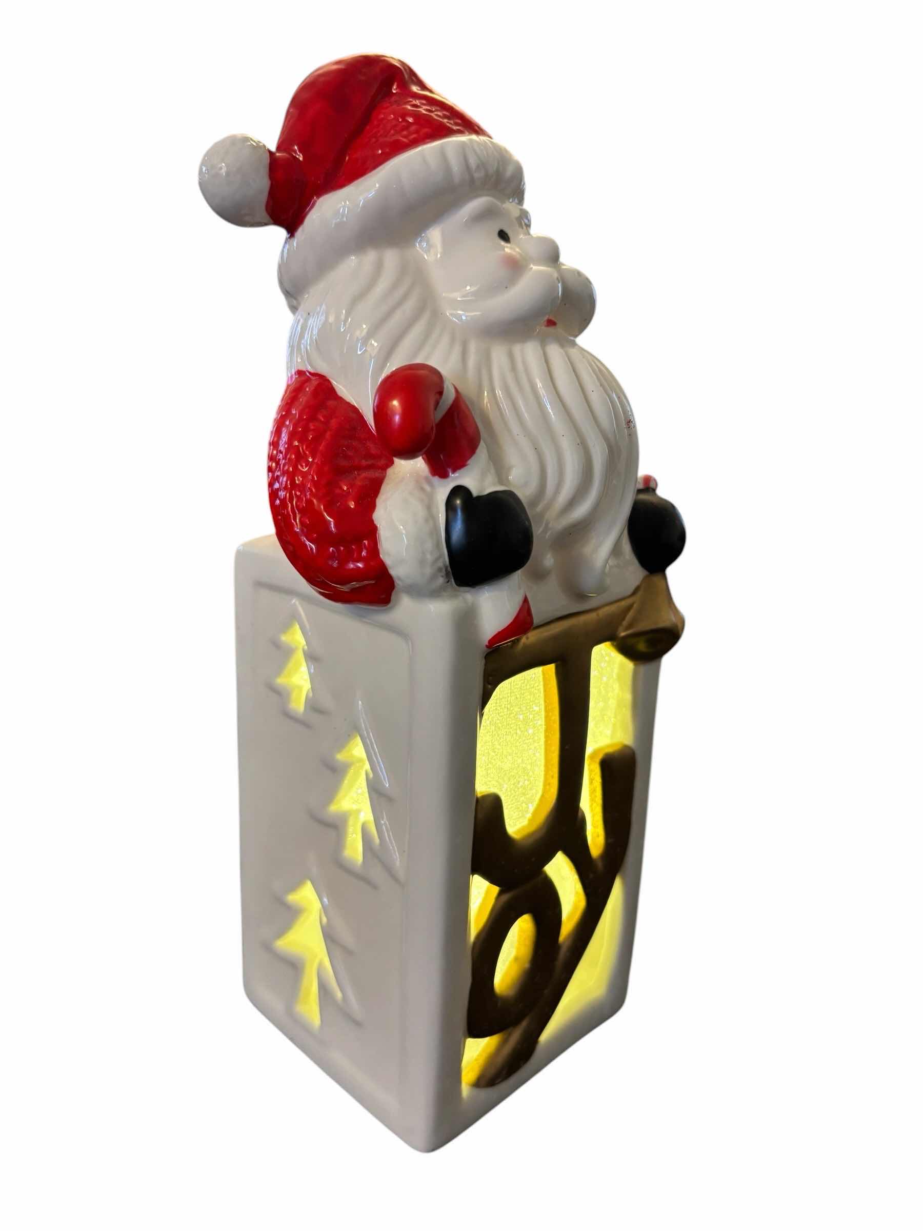 Photo 1 of LIGHT-UP CERAMIC 9.5” SANTA DECOR & 12 PC RED/SILVER GLASS MIRRORBALL ORNAMENTS IN DECORATIVE STORAGE BOX