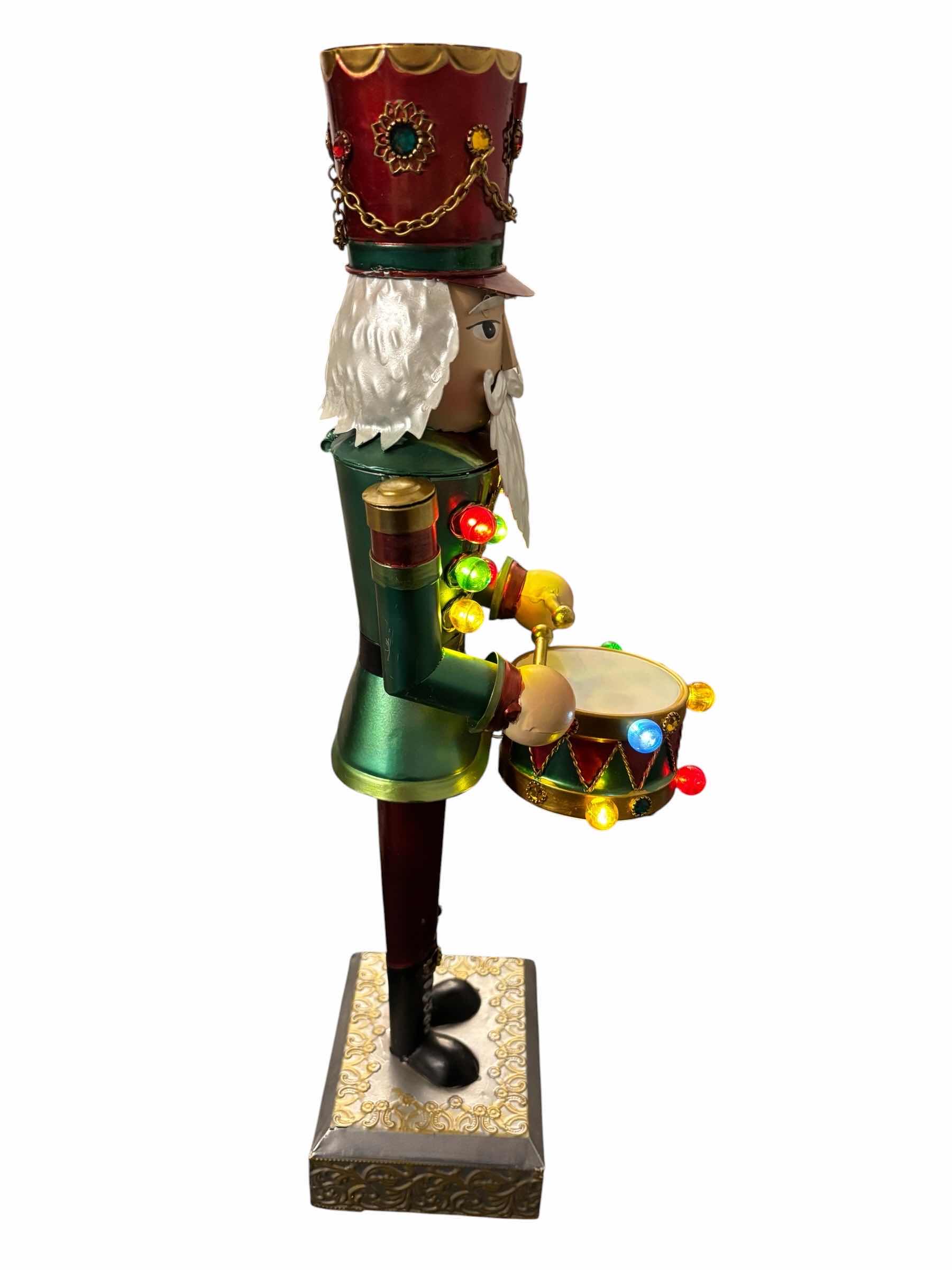 Photo 1 of 21” TIN LIGHT-UP NUTCRACKER $55