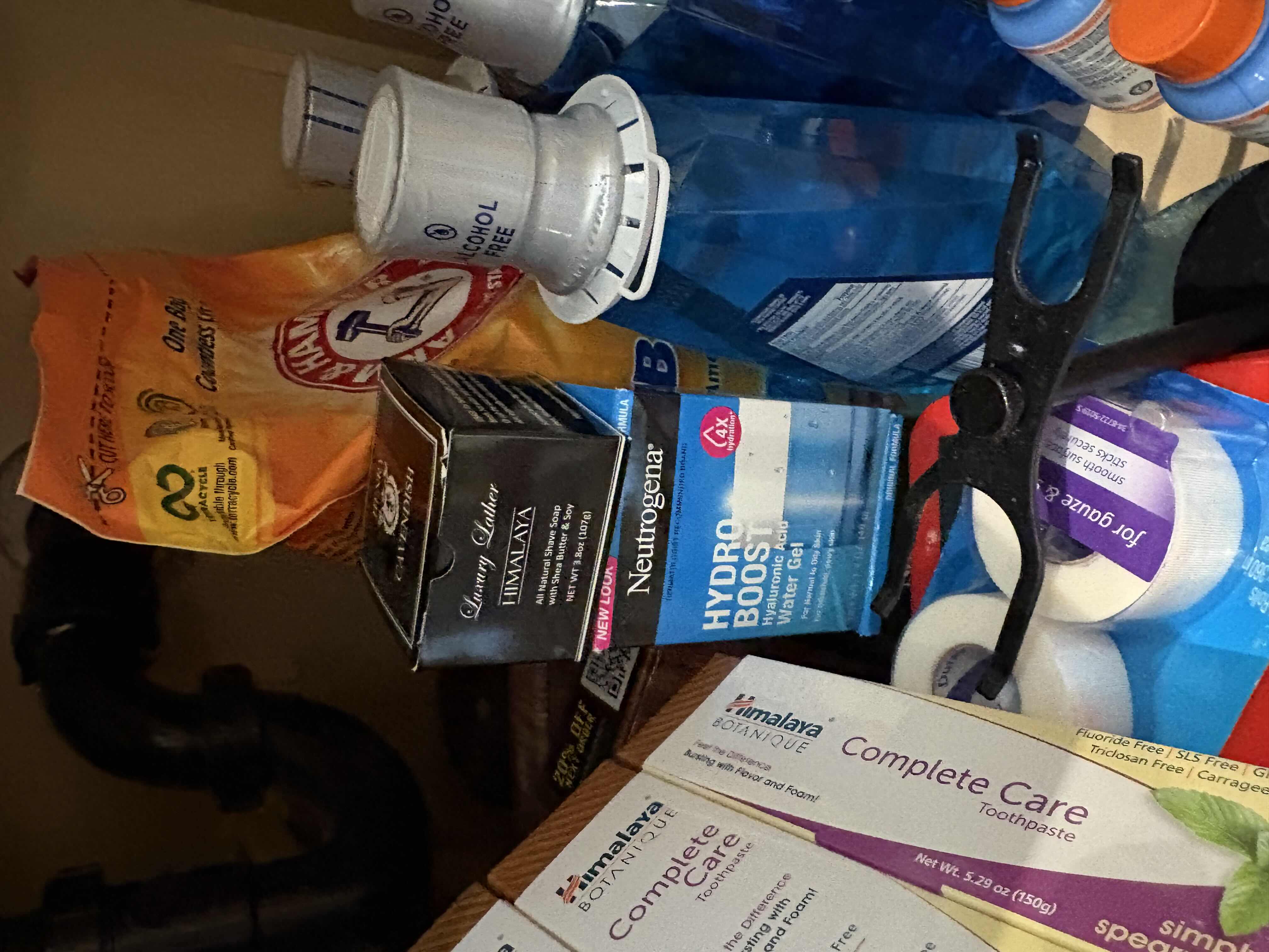 Photo 1 of CONTENTS OF PRIMARY BATHROOM CABINET NEW MOUTHWASH, TOOTHPASETE AND MORE