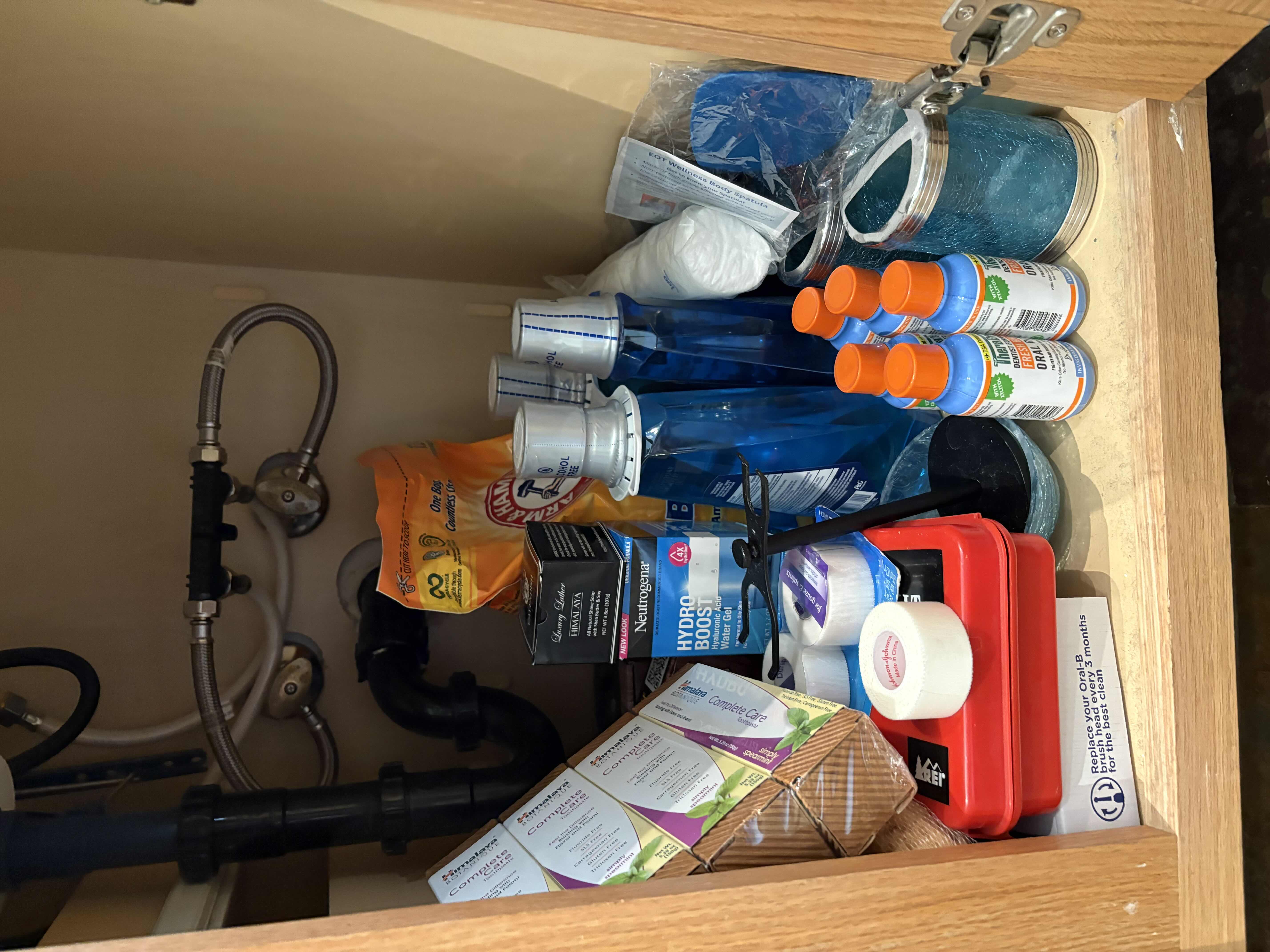 Photo 1 of CONTENTS OF PRIMARY BATHROOM CABINET NEW MOUTHWASH, TOOTHPASETE AND MORE