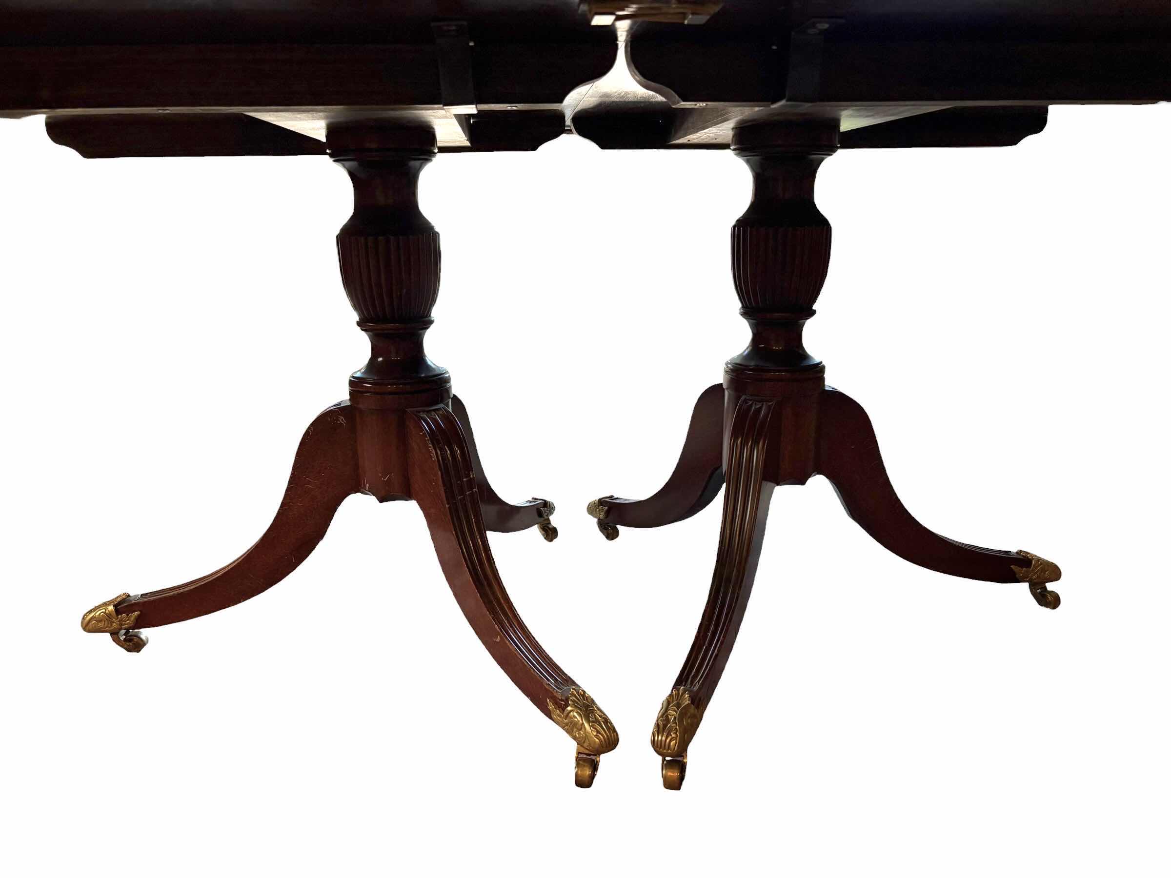 Photo 1 of ANTIQUE MAHOGANY ENGLISH DINING TABLE W/BRASS PAW FEET COMES WITH TWO ADDITIONAL LEAFS AND FOLDABLE TABLE COVERS
72”X48”H30 W LEAFS TOTAL L144”