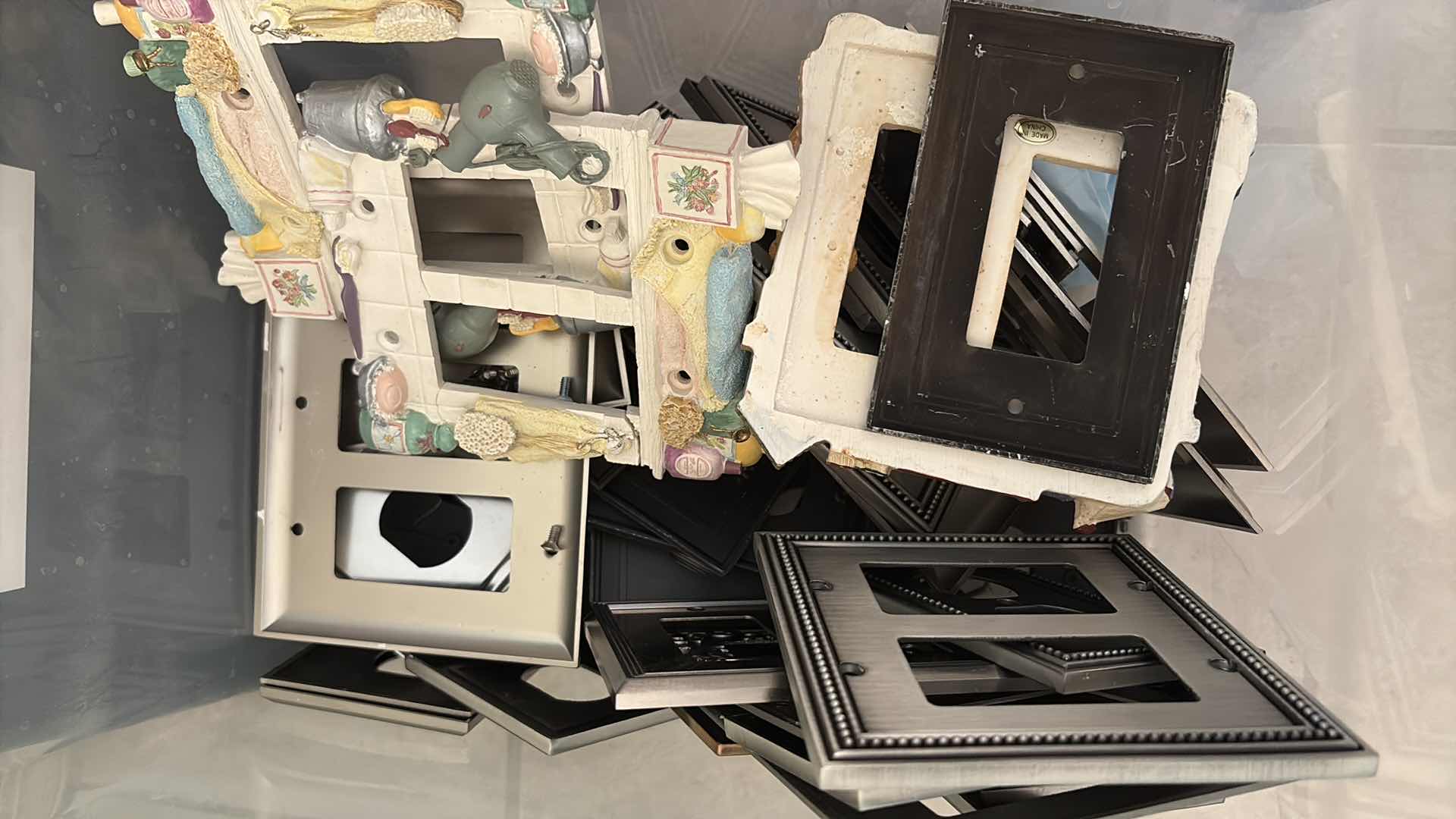 Photo 1 of CONTAINER OF DECORATIVE METAL & RESIN LIGHT SWITCH / OUTLET COVER LOT