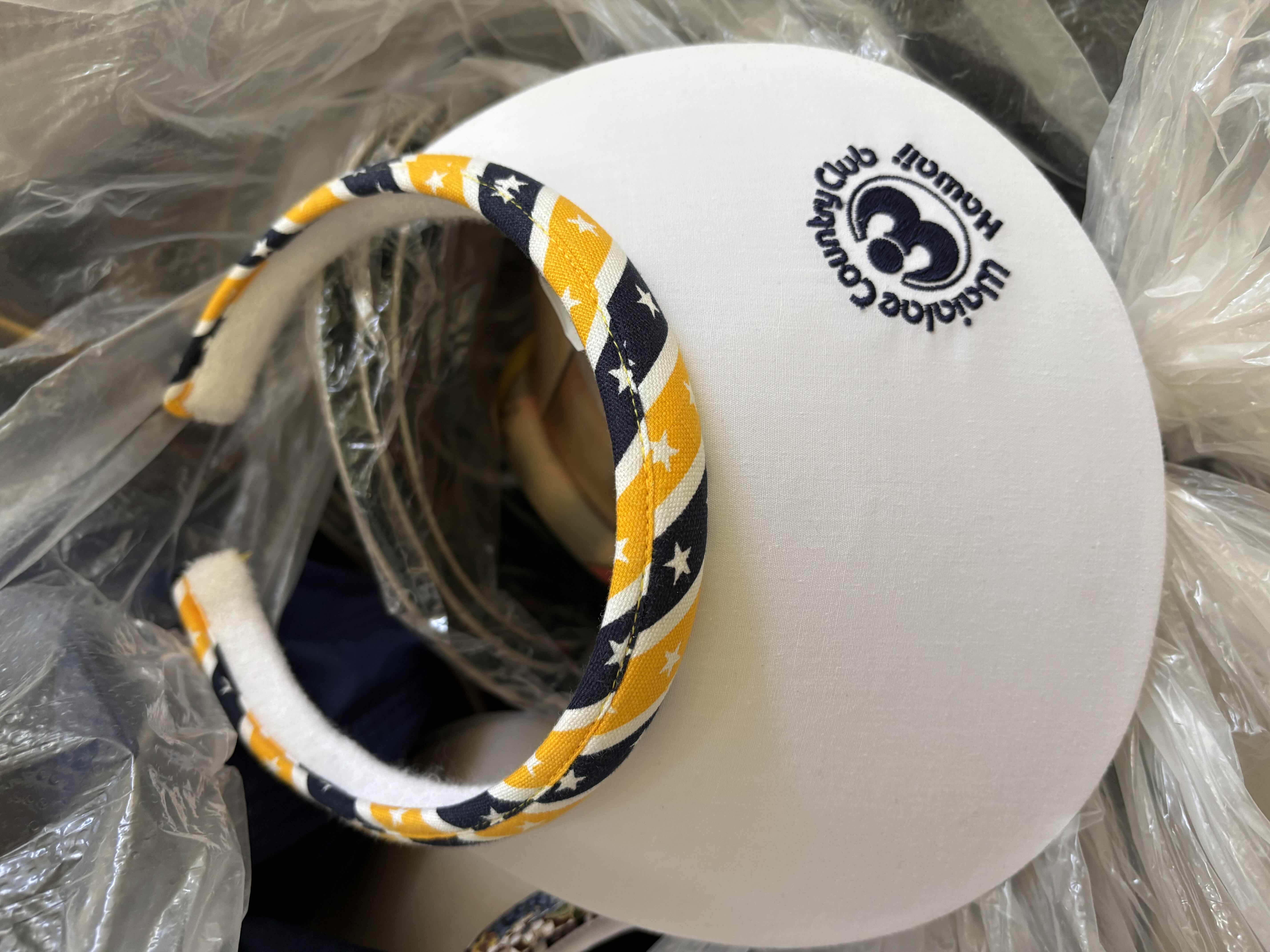 Photo 1 of LARGE BAG OF VISORS IN MULTIPLE COLORS & STYLES
