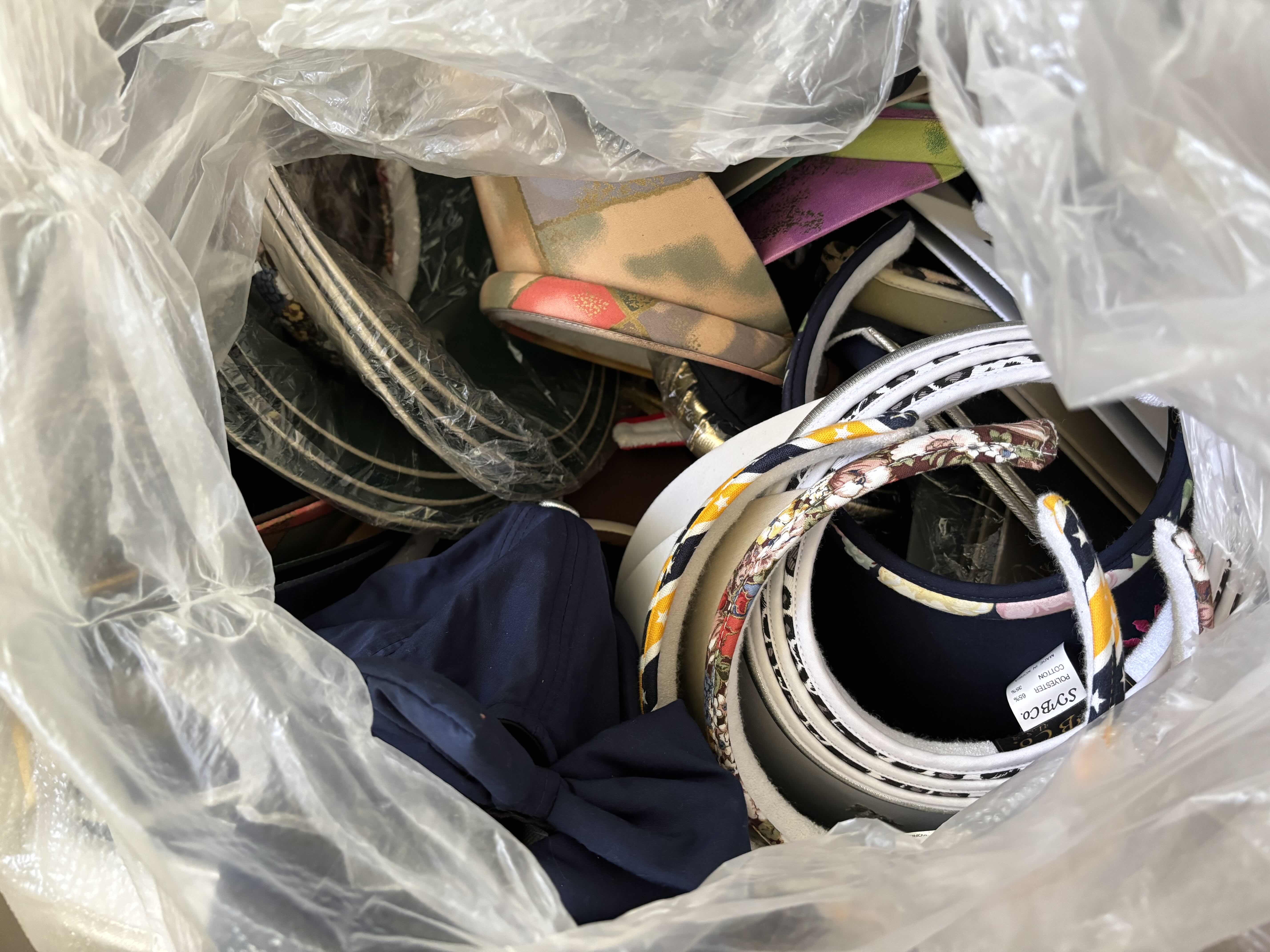 Photo 1 of LARGE BAG OF VISORS IN MULTIPLE COLORS & STYLES