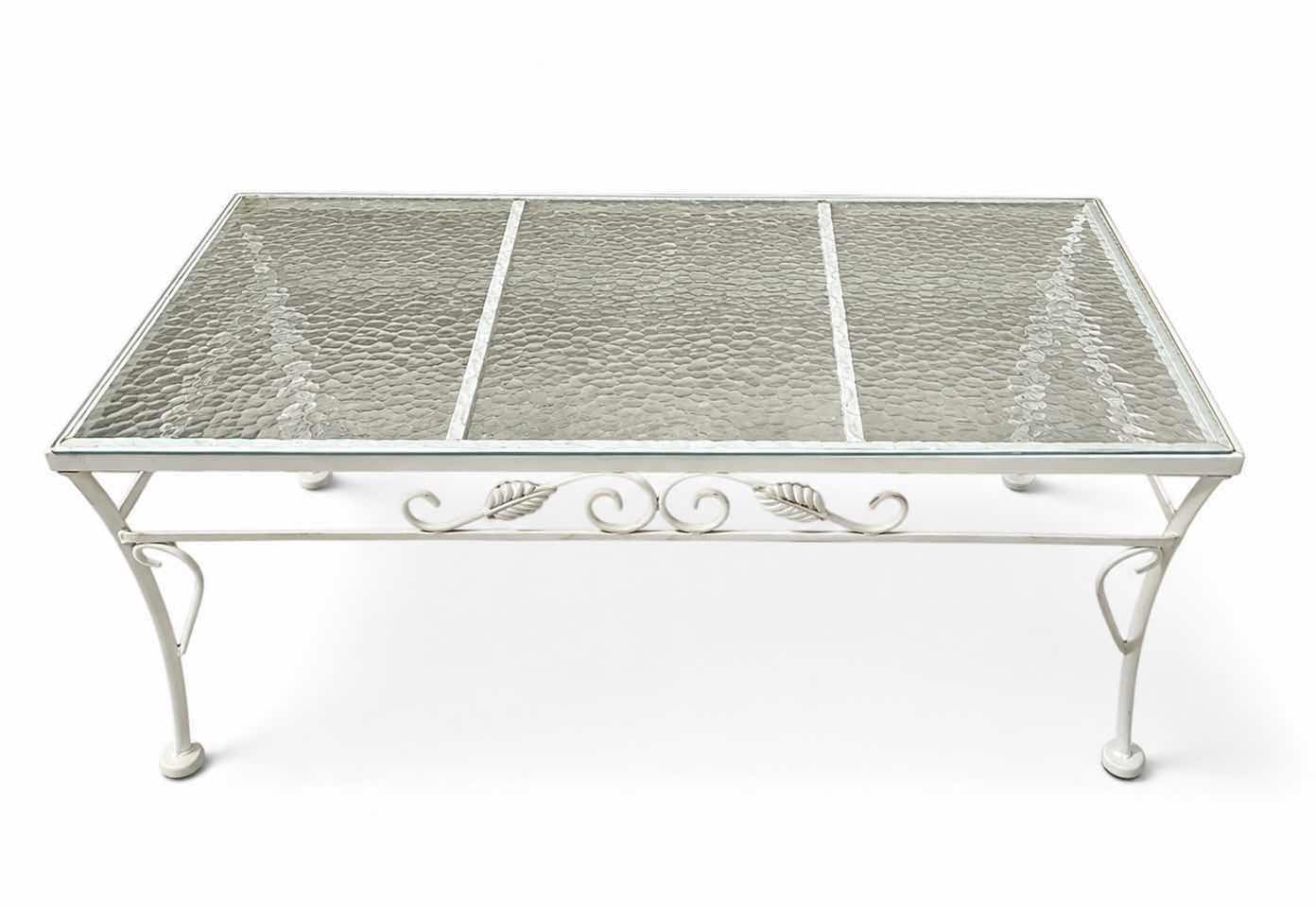 Photo 1 of WHITE WROUGHT IRON PATIO COFFEE TABLE W A GLASS TOP, OFTEN STYLED IN THE HOLLYWOOD REGENCY FASHION. 40“ X 20“ X H14 1/4“