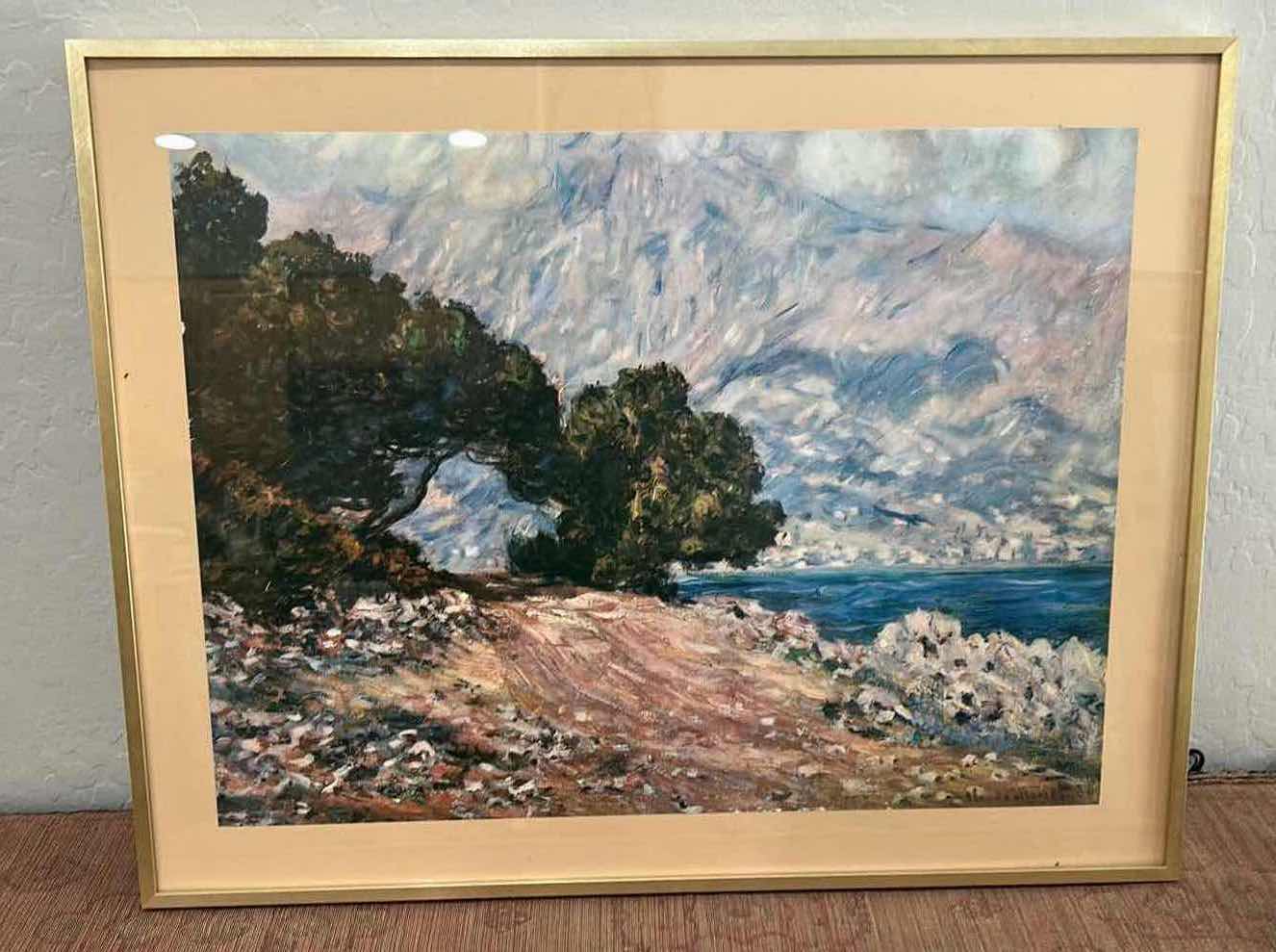 Photo 1 of FRAMED REPRODUCTION ART PRINT OF CLAUDE MONET’S “CAP MARTIN, NEAR MENTON, 1884”. ARTWORK. 28 1/4” x H22 1/2”