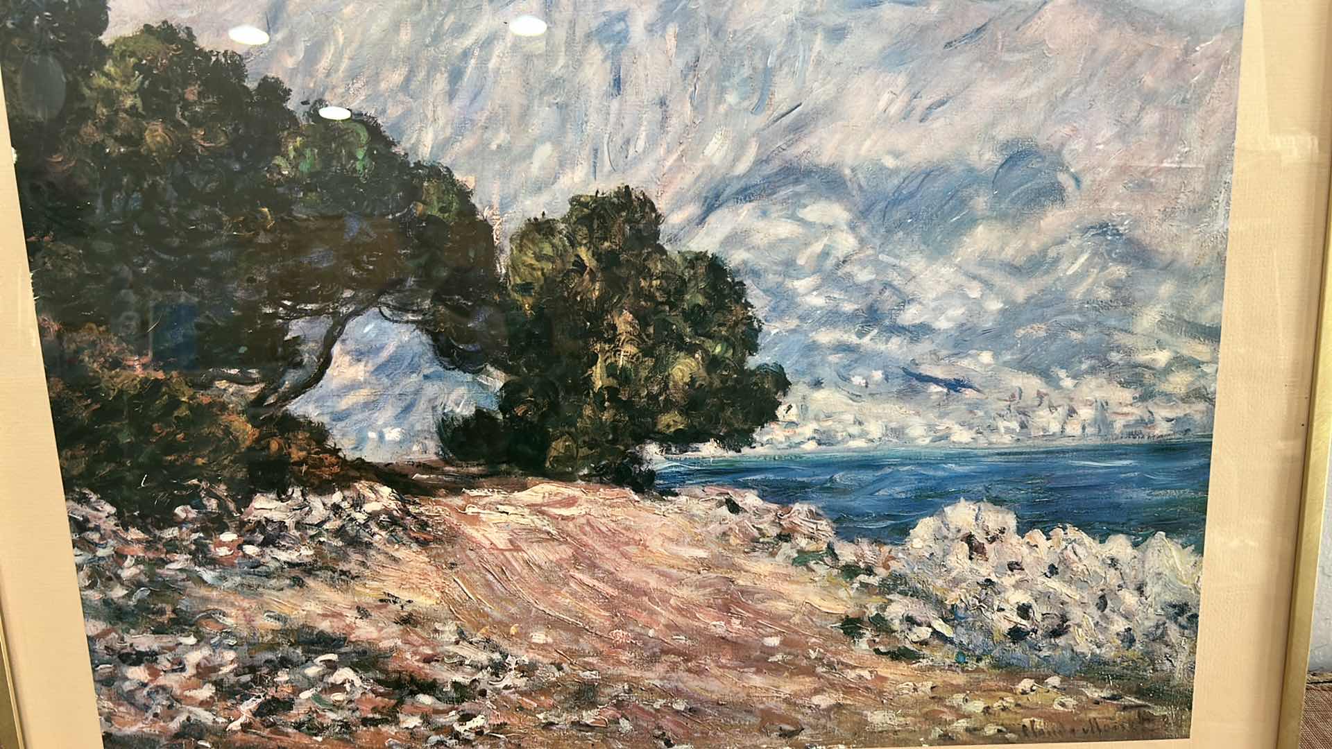 Photo 1 of FRAMED REPRODUCTION ART PRINT OF CLAUDE MONET’S “CAP MARTIN, NEAR MENTON, 1884”. ARTWORK. 28 1/4” x H22 1/2”