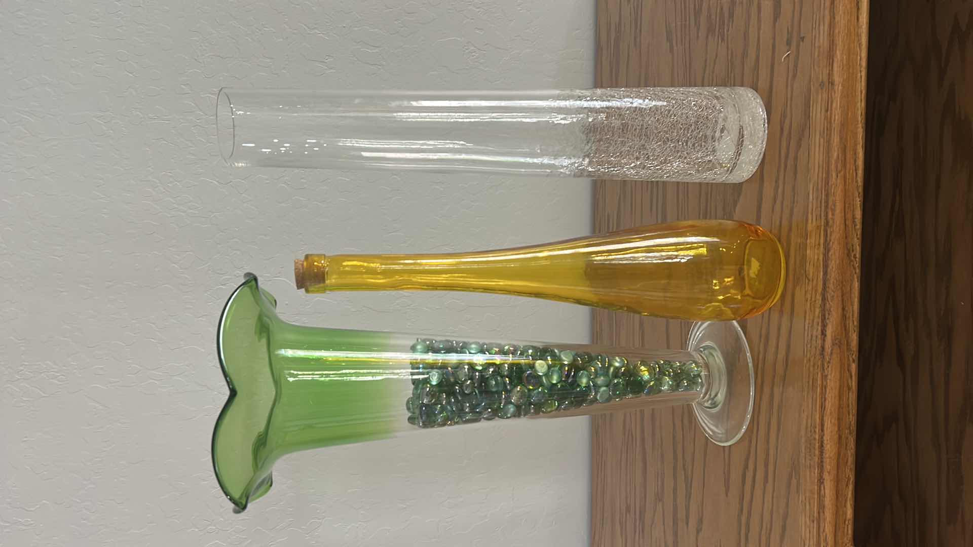 Photo 1 of 3 TALL GLASS VASES (TALLEST H20”)