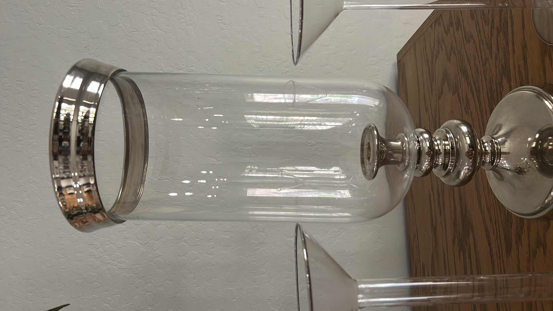Photo 1 of HURRICANE CANDLE LAMP H21”AND TWO SILVER RIMMED GLASS CANDLE HOLDERS
