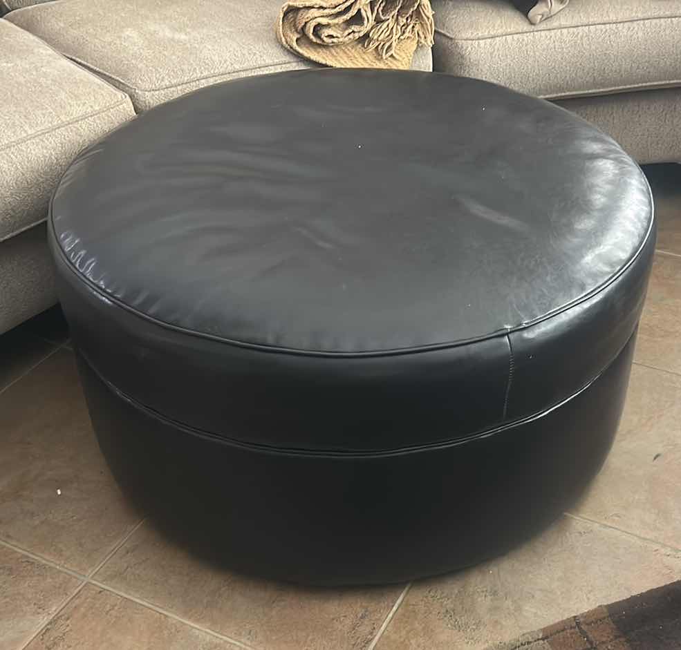 Photo 1 of ASHLEY FURNITURE ROUND IMITATION LEATHER OTTOMAN 38” x H19”