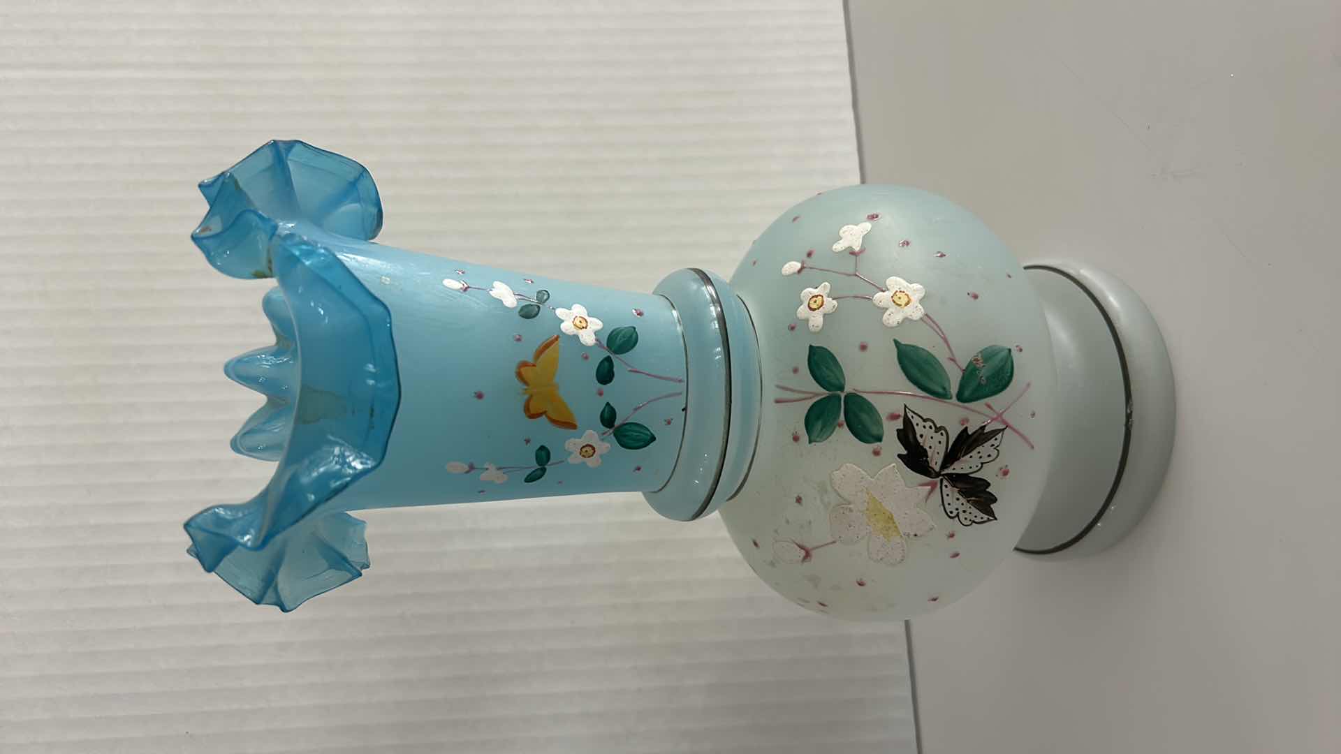 Photo 1 of VINTAGE BRISTOL GLASS VASE FEATURING A HAND-PAINTED BUTTERFLY & FLORAL ENAMEL DESIGN W A BLUE RUFFLED RIM H10.25”