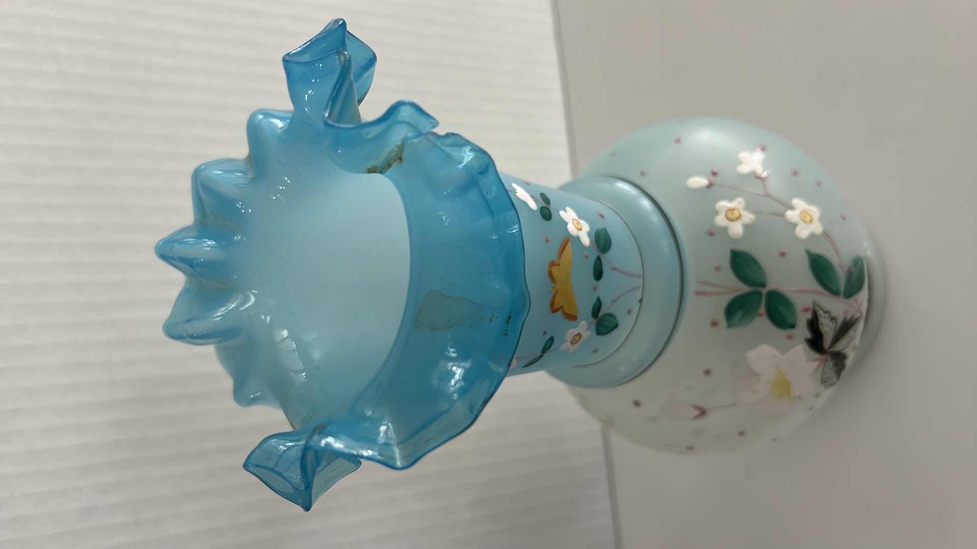 Photo 1 of VINTAGE BRISTOL GLASS VASE FEATURING A HAND-PAINTED BUTTERFLY & FLORAL ENAMEL DESIGN W A BLUE RUFFLED RIM H10.25”