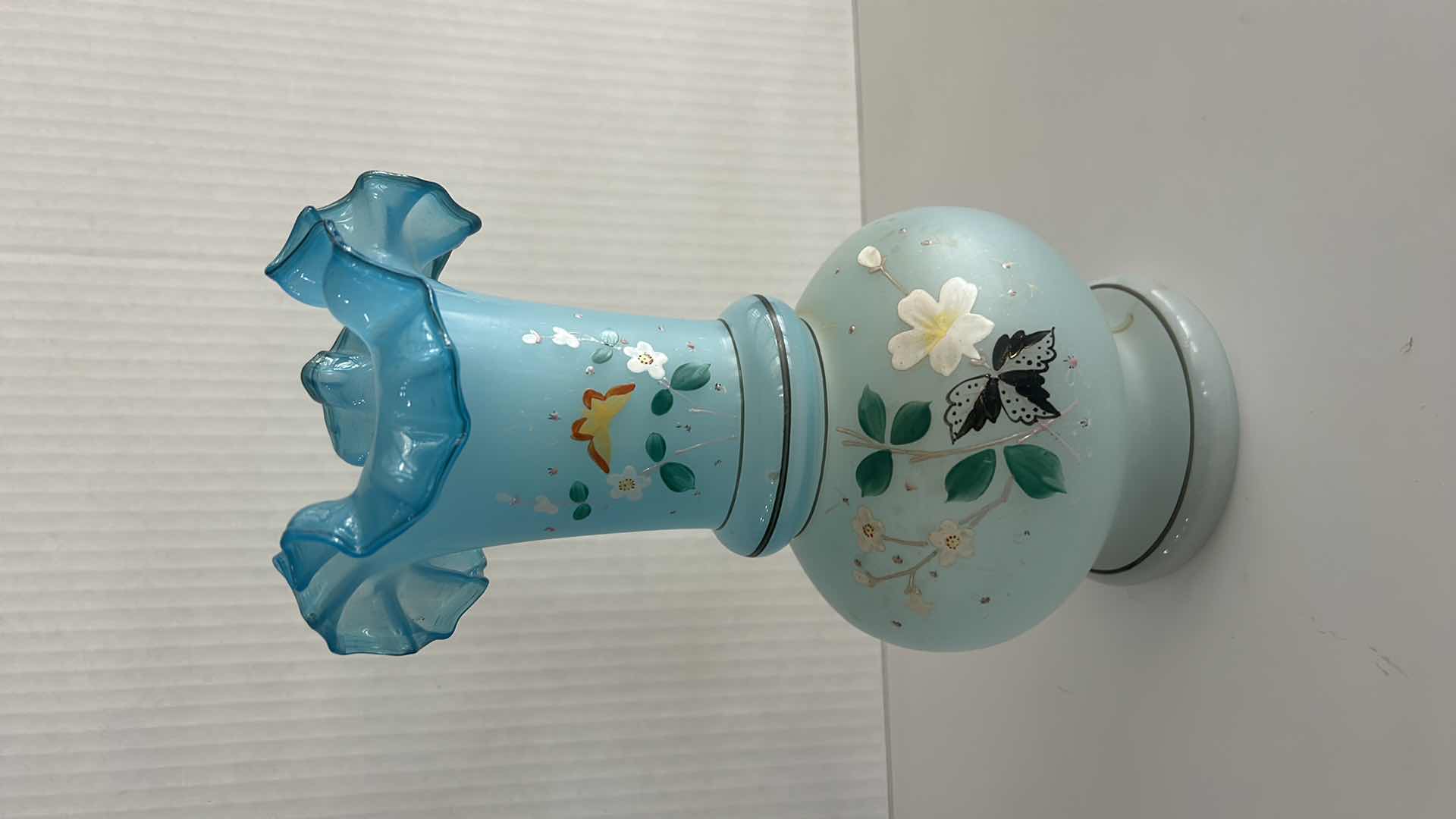 Photo 1 of VINTAGE BRISTOL GLASS VASE FEATURING A HAND-PAINTED BUTTERFLY & FLORAL ENAMEL DESIGN W A BLUE RUFFLED RIM H10.25