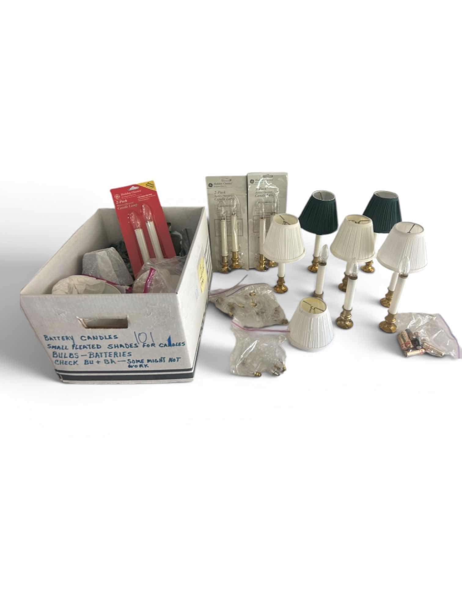 Photo 1 of BOX FULL OF BATTERY CANDLES, SMALL PLEATED SHADES FOR CANDLES, BULBS - BATTERIES