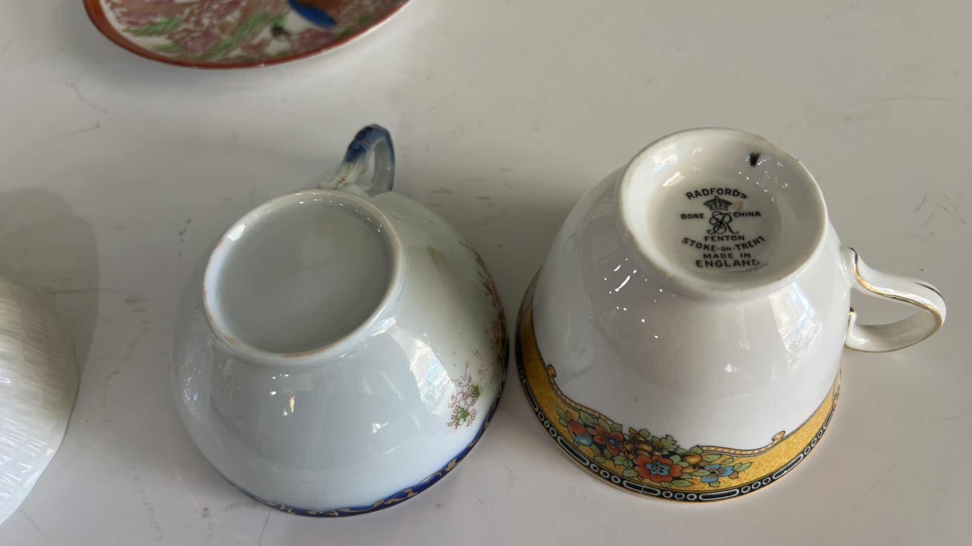 Photo 1 of MISMATCHED TEA, CUPS, AND SAUCERS