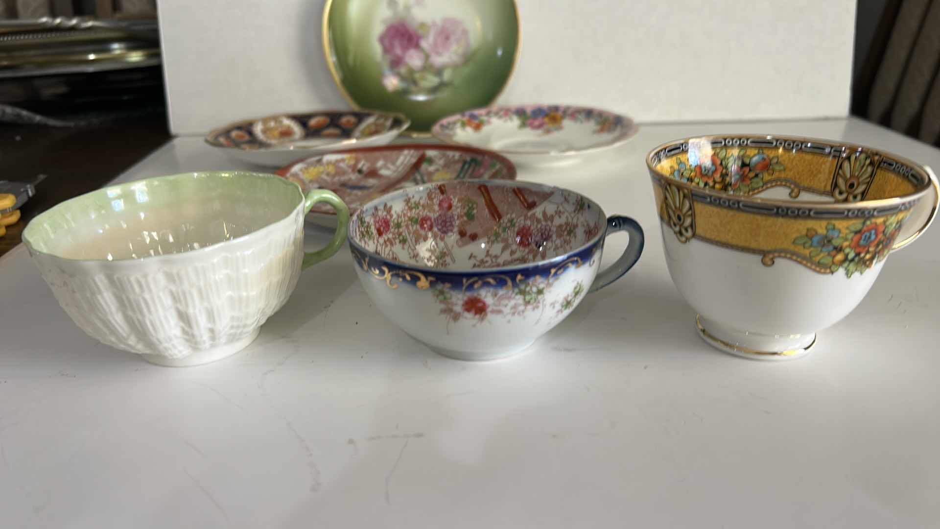 Photo 1 of MISMATCHED TEA, CUPS, AND SAUCERS