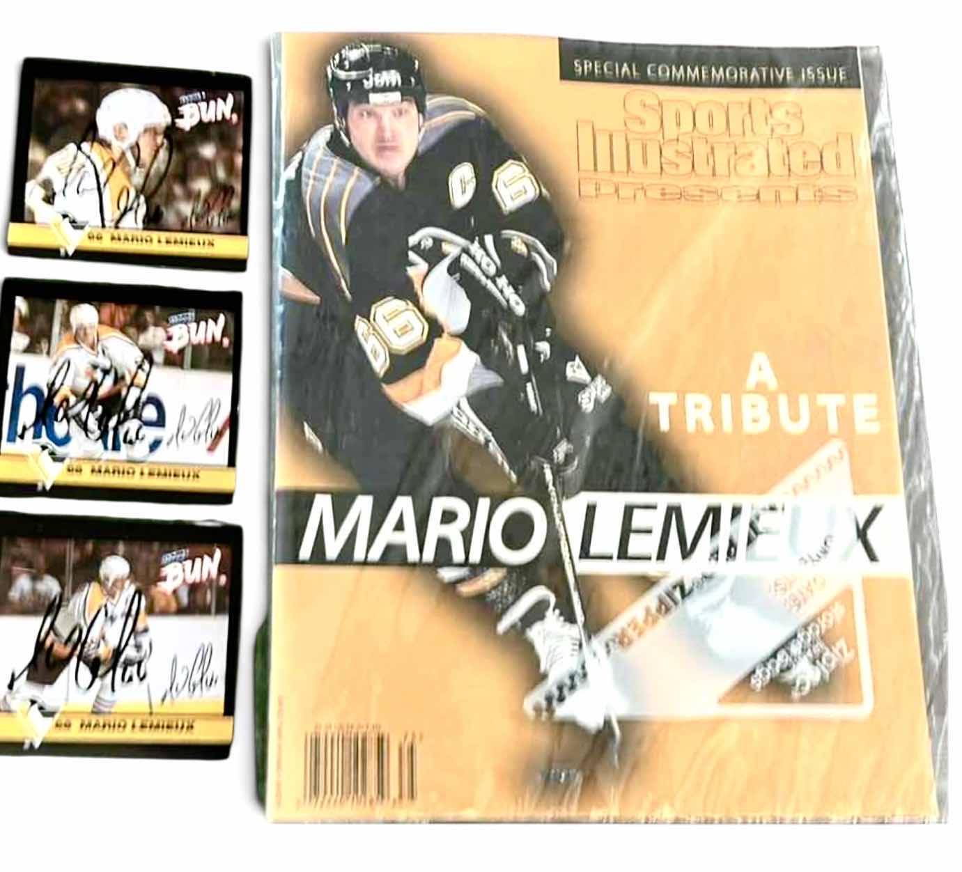 Photo 1 of COLLECTION OF MARIO LEMIEUX MEMORABILIA, SPECIFICALLY FEATURING A 1997 SPORTS ILLUSTRATED SPECIAL COMMEMORATIVE ISSUE AND ACCOMPANYING TRADING CARDS