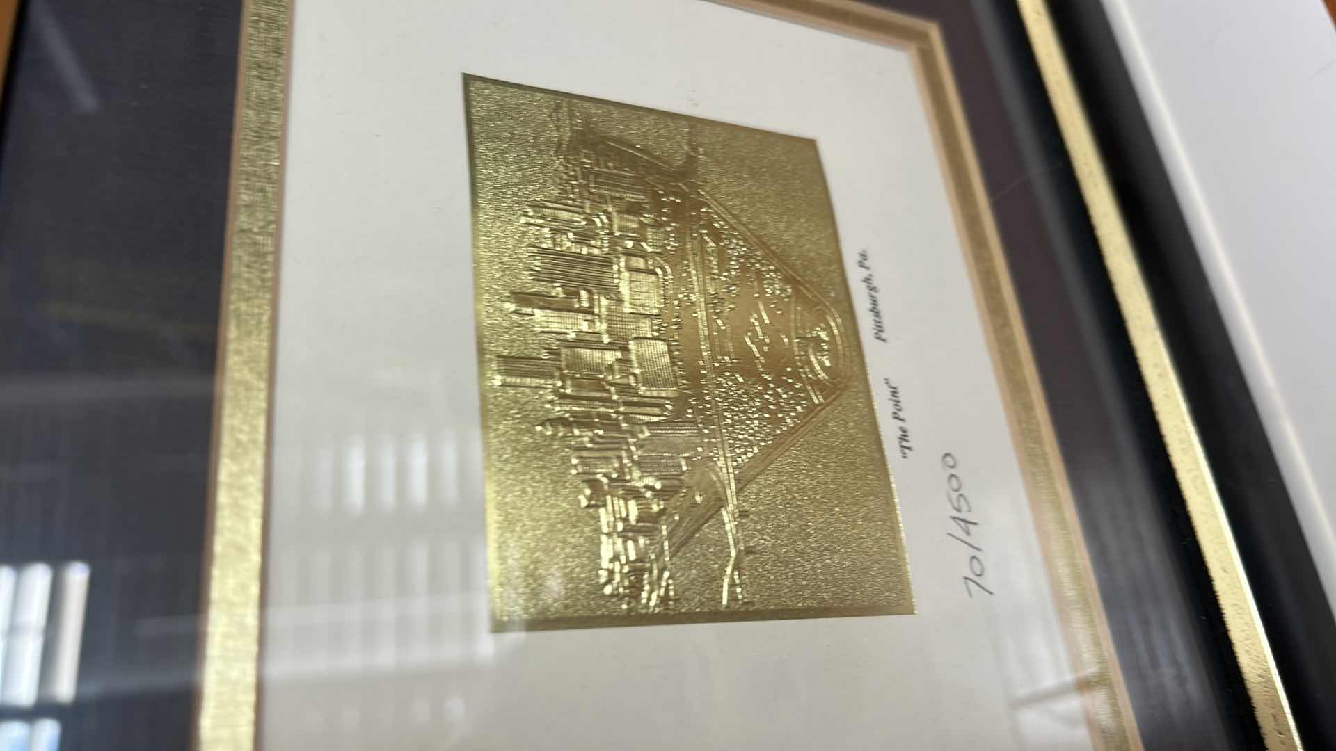 Photo 1 of TWO - FRAMED ARTWORK, PRINT REPRESENTING THE CATHEDRAL OF LEARNING AT THE UNIVERSITY OF PITTSBURGH AND LIMITED EDITION GOLD TONED METAL RELIEF PRINT TITLED “THE POINT” DEPICTING THE PITTSBURGH PA SKYLINE, NUMBER 70 OUT OF 4500. 11 3/4” x H9 3/4”