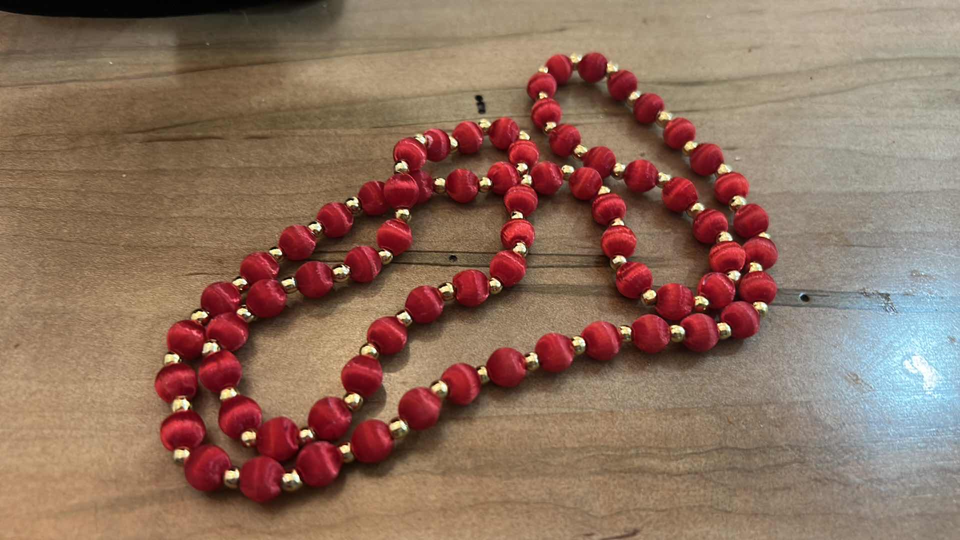 Photo 1 of THREE VINTAGE RED BEADED NECKLACES