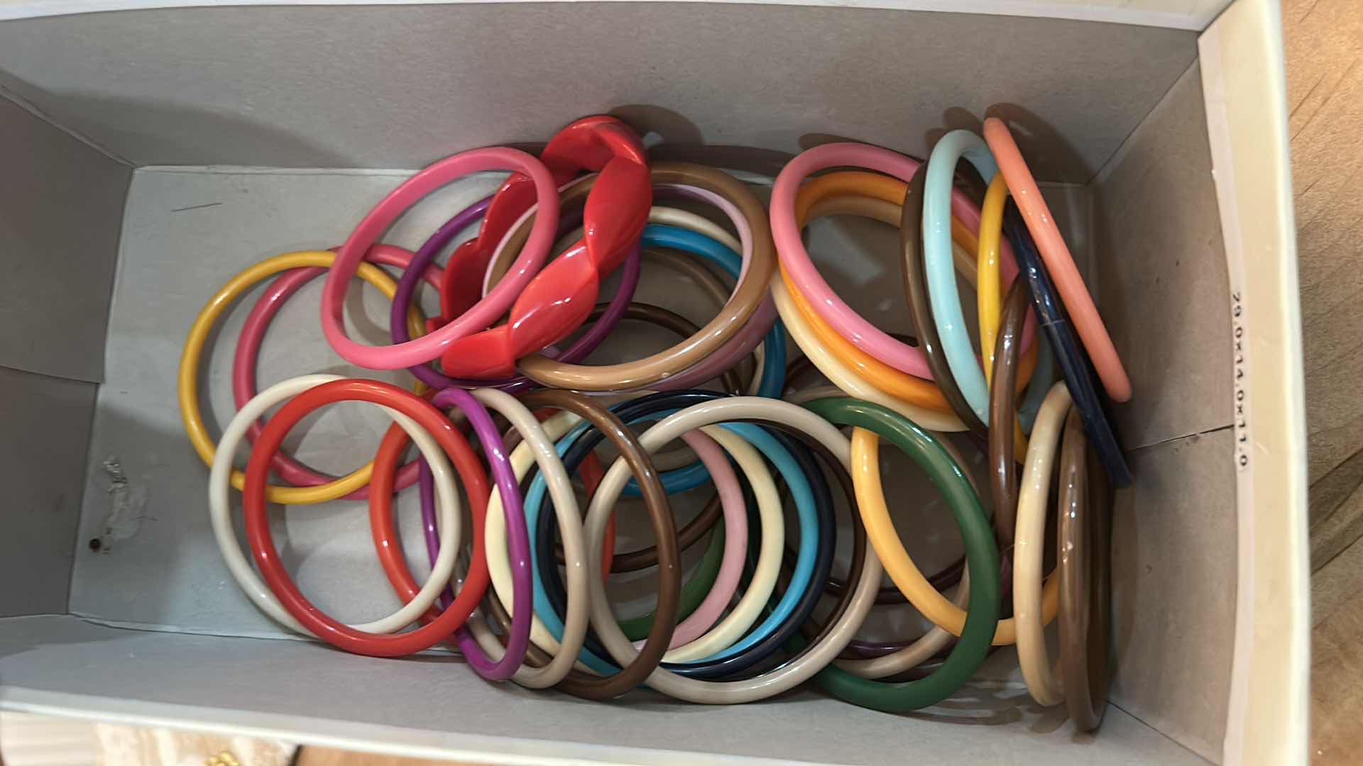 Photo 1 of BOX OF MULTICOLORED BRACELETS