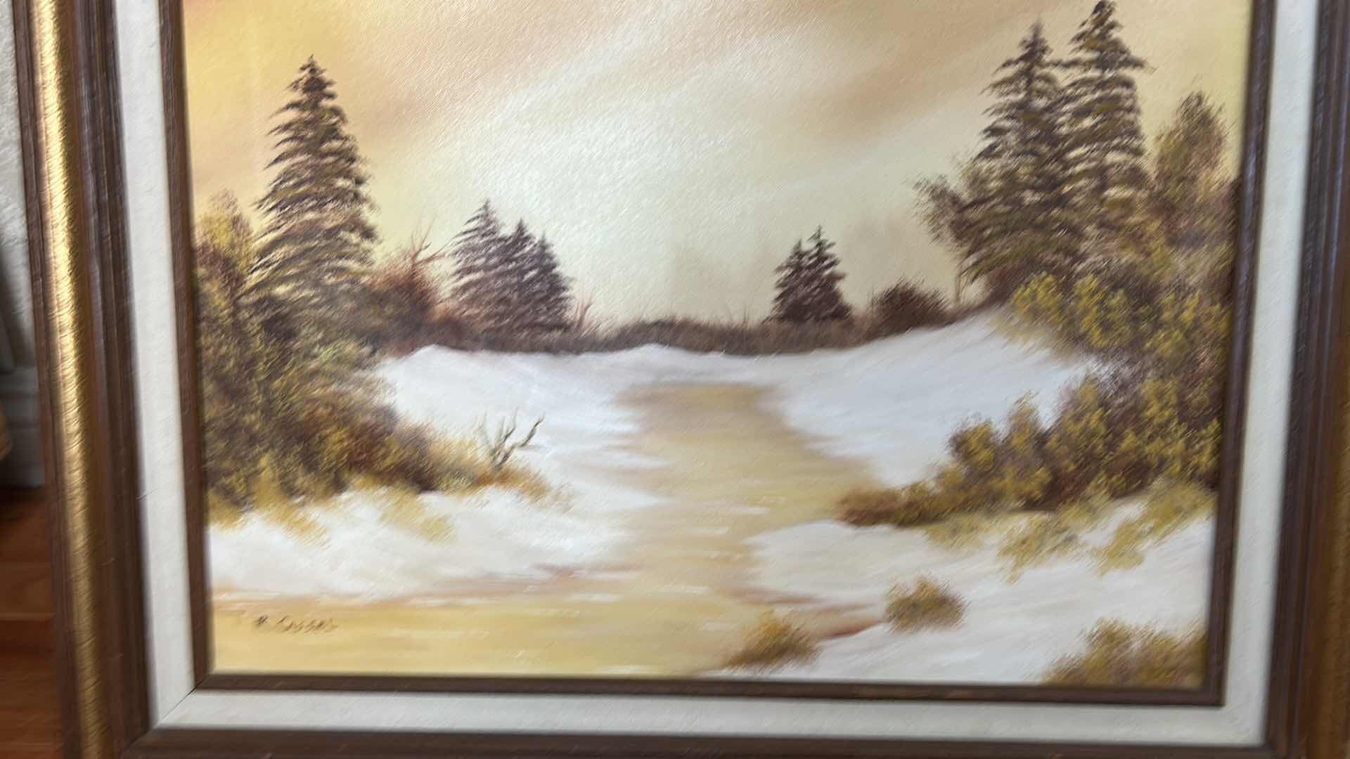 Photo 1 of VINTAGE FRAMED OIL ON CANVAS ARTWORK, WINTER LANDSCAPE SIGNED BY THE ARTIST RENOS. 25 1/2” x H21 1/2”