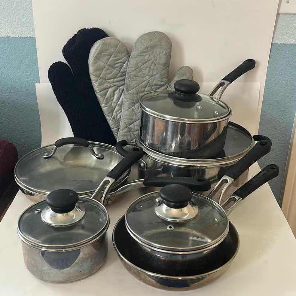 Photo 1 of FARBERWARE POTS AND PANS WITH LIDS AND OVEN MITTS