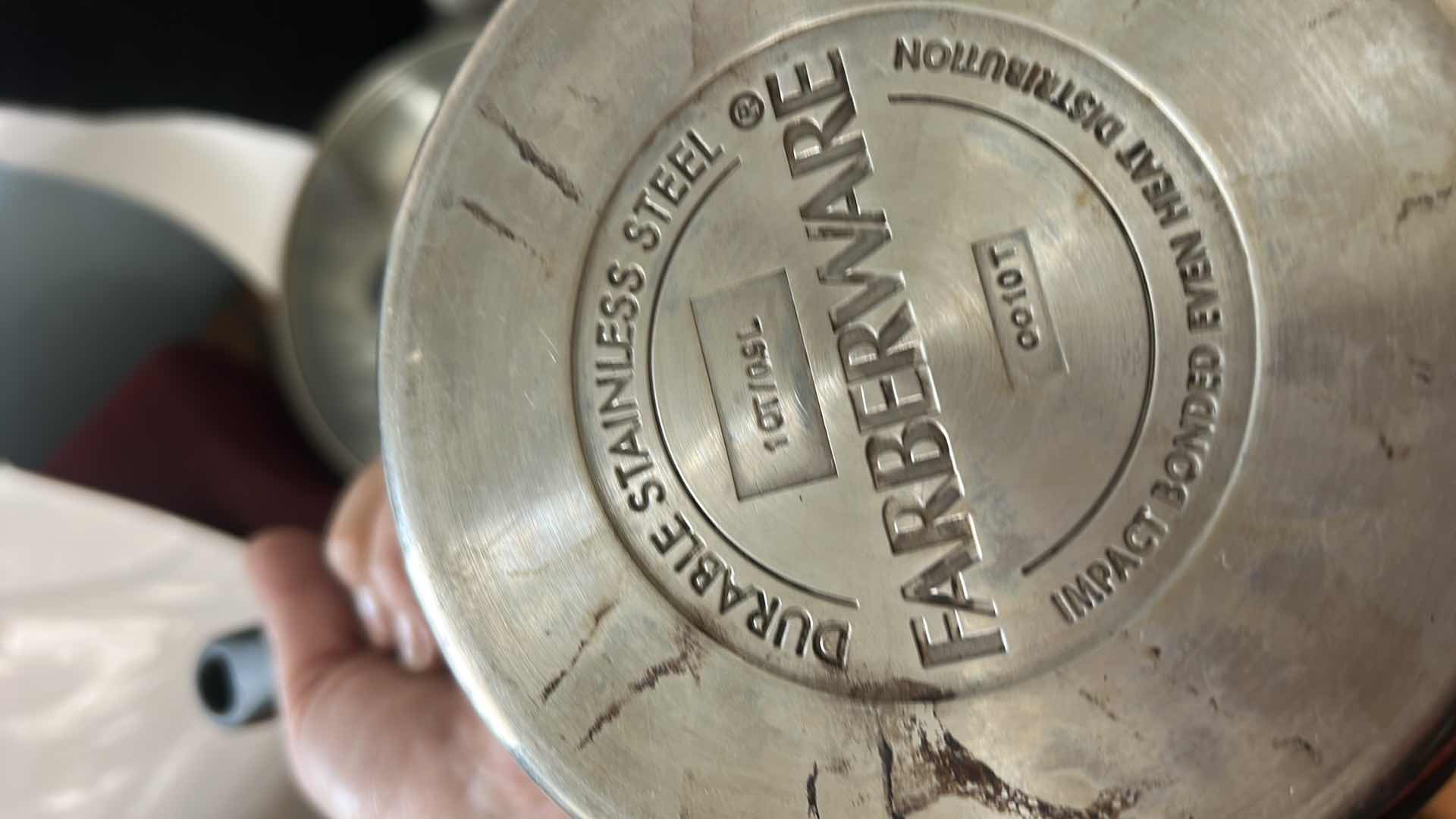 Photo 1 of FARBERWARE POTS AND PANS WITH LIDS AND OVEN MITTS