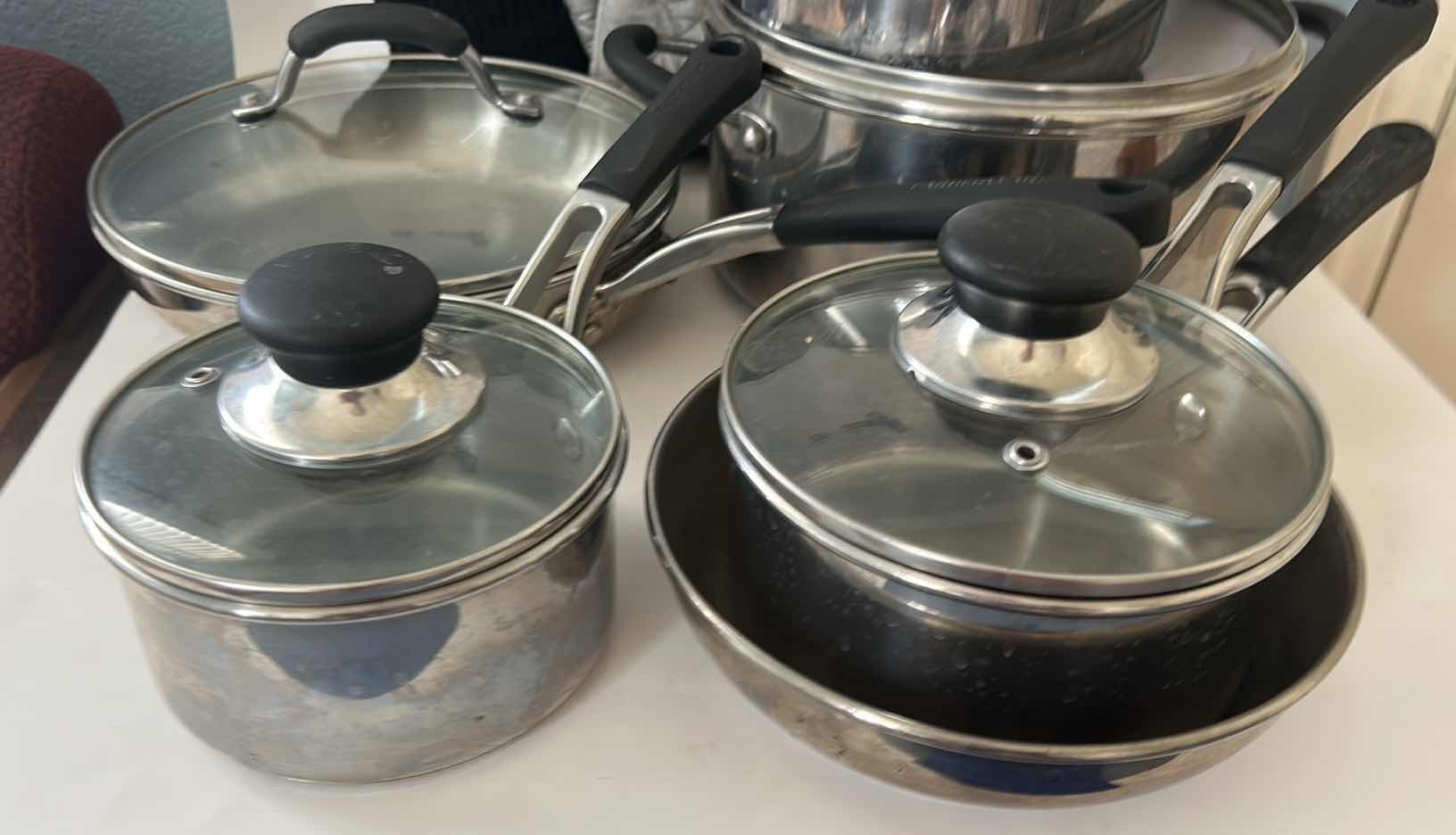 Photo 1 of FARBERWARE POTS AND PANS WITH LIDS AND OVEN MITTS