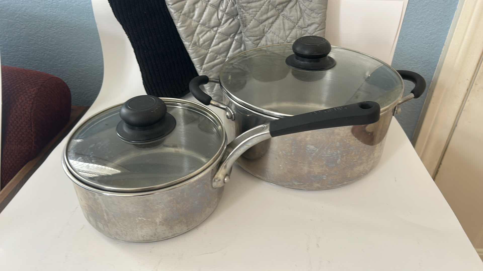 Photo 1 of FARBERWARE POTS AND PANS WITH LIDS AND OVEN MITTS