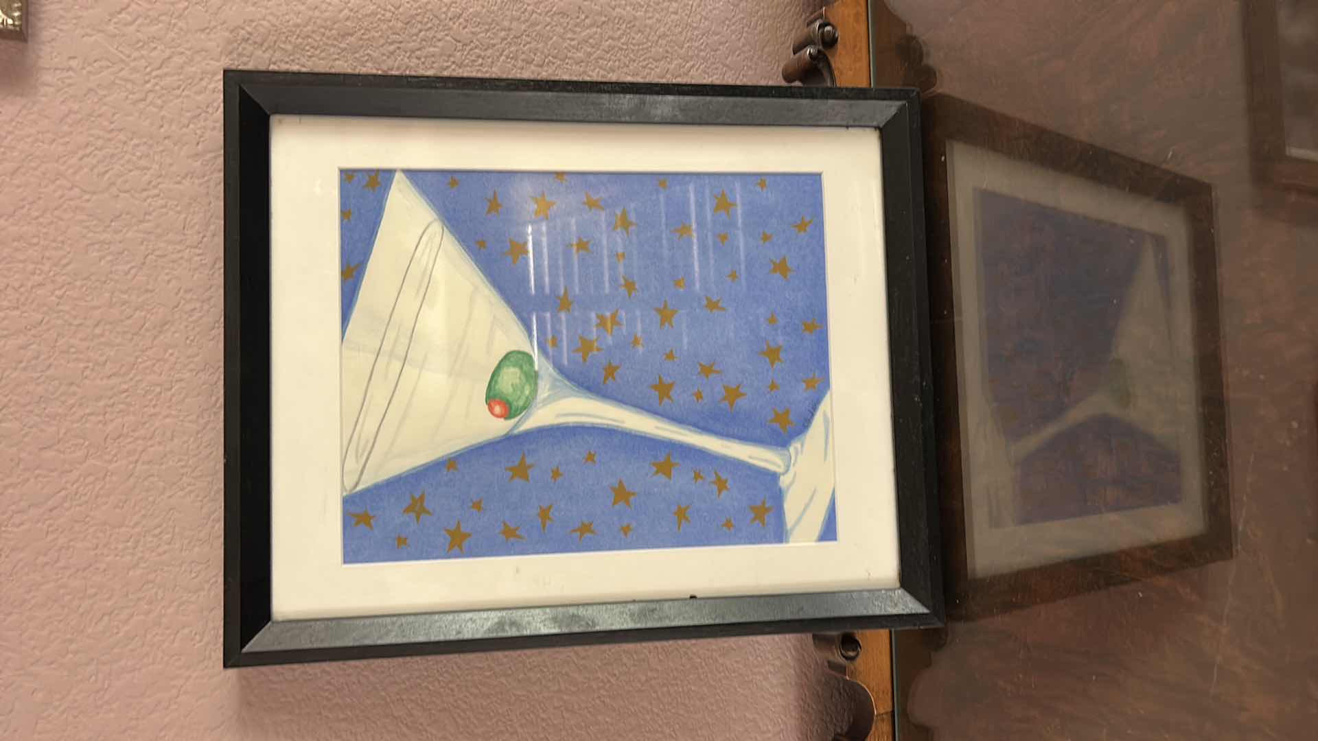 Photo 1 of FRAMED SIGNED ARTWORK FEATURING A WHIMSICAL ILLUSTRATION OF A CLASSIC MARTINI GLASS WITH A GREEN PIMENTO STUFFED OLIVE 12 1/4” x H15 1/4”