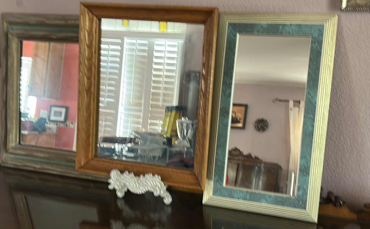 Photo 1 of THREE FRAMED WALL MIRRORS. (TALLEST H19”)