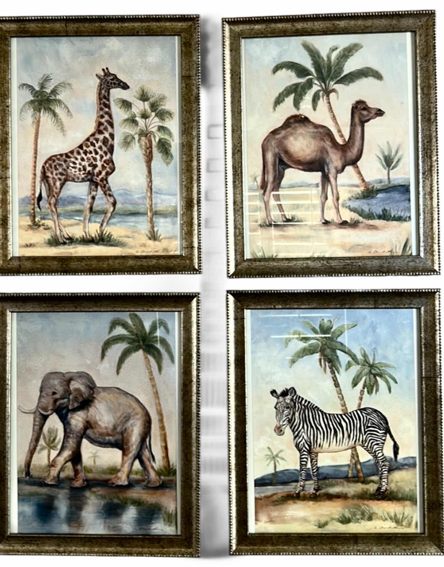 Photo 1 of SET A FOUR "ANIMALS AFRICANA" PRINT ARTWORK PIECES BY ALEXANDRA CHURCHILL, FEATURING A GIRAFFE, CAMEL, ELEPHANT AND ZEBRA IN RUSTIC GOLD FRAMES. 13” x H 16”