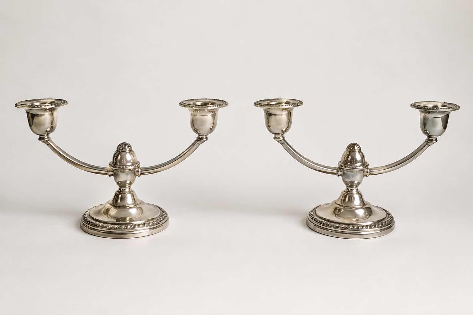 Photo 1 of PAIR OF STAMPED STERLING SILVER CANDELABRAS ( BOTTOMS REINFORCED WITH CEMENT FOR STABILITY)H5”