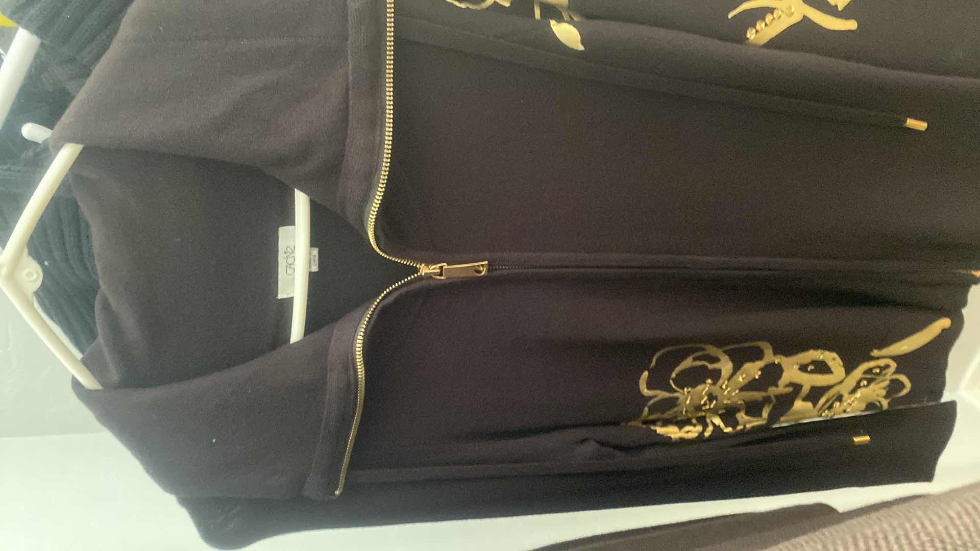 Photo 1 of 10-WOMEN’S CLOTHING, SWEATERS, AND PANTS SIZES SMALL AND MEDIUM