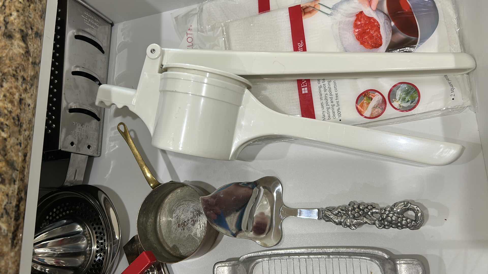 Photo 1 of CONTENTS OF DRAWER COOKING UTENSILS