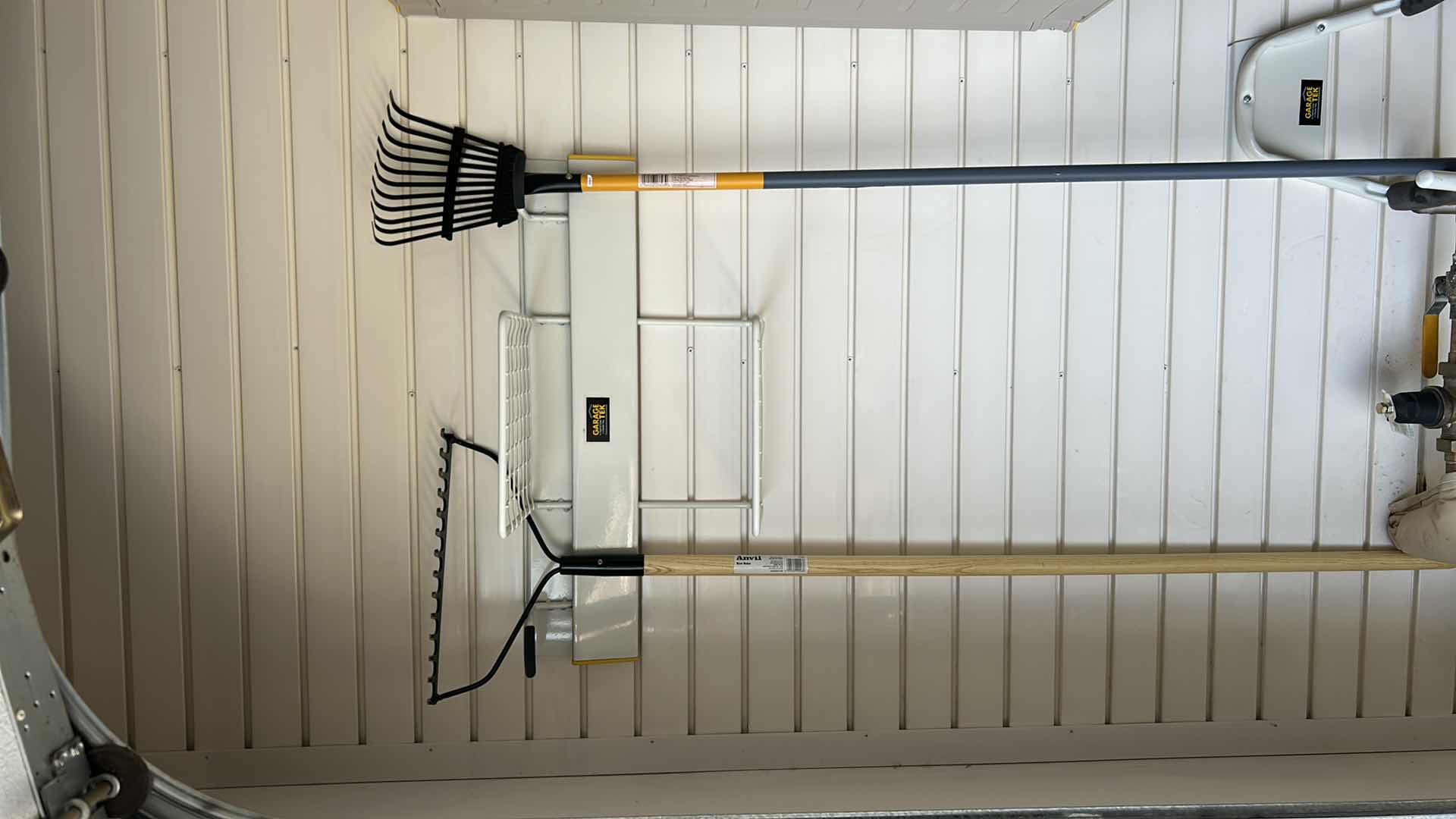 Photo 1 of CONTENTS OF GARAGE CABINET GARDENING RAKE