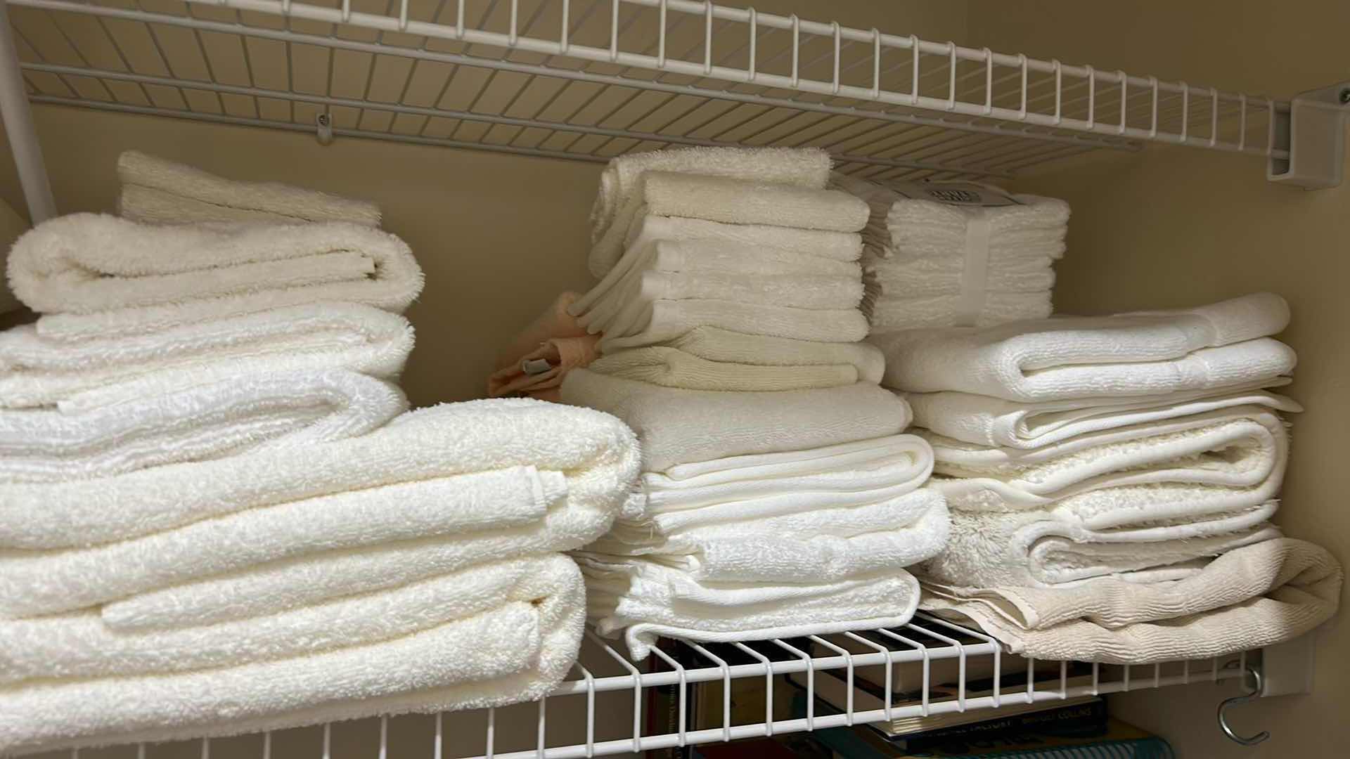 Photo 1 of CONTENTS OF SHELF ASSORTMENT OF WHITE TOWELS