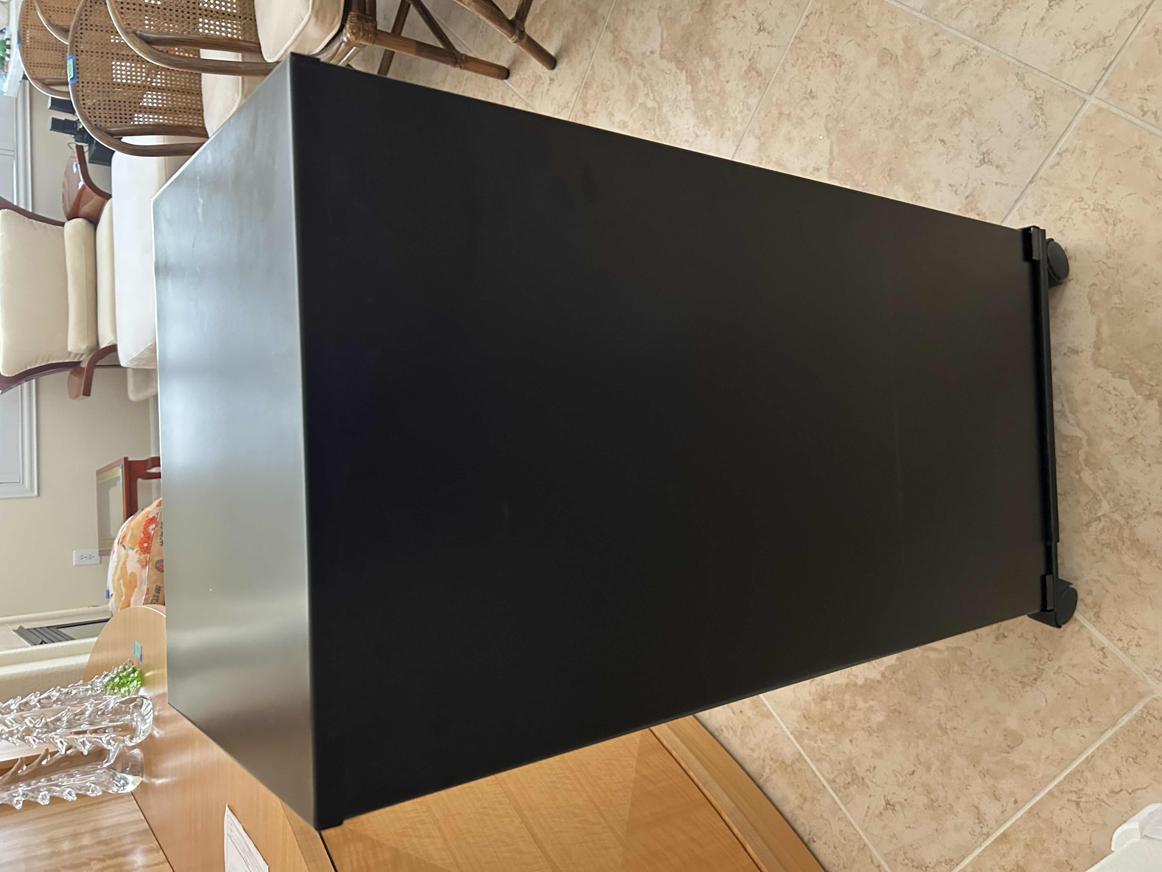 Photo 1 of BLACK VERTICAL METAL FILE CABINET ON COASTERS